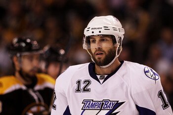 BOSTON, MA - MAY 17:  Simon Gagne #12 of the Tampa Bay Lightning looks on in Game Two of the Eastern Conference Finals against the Boston Bruins during the 2011 NHL Stanley Cup Playoffs at TD Garden on May 17, 2011 in Boston, Massachusetts.  (Photo by Bru