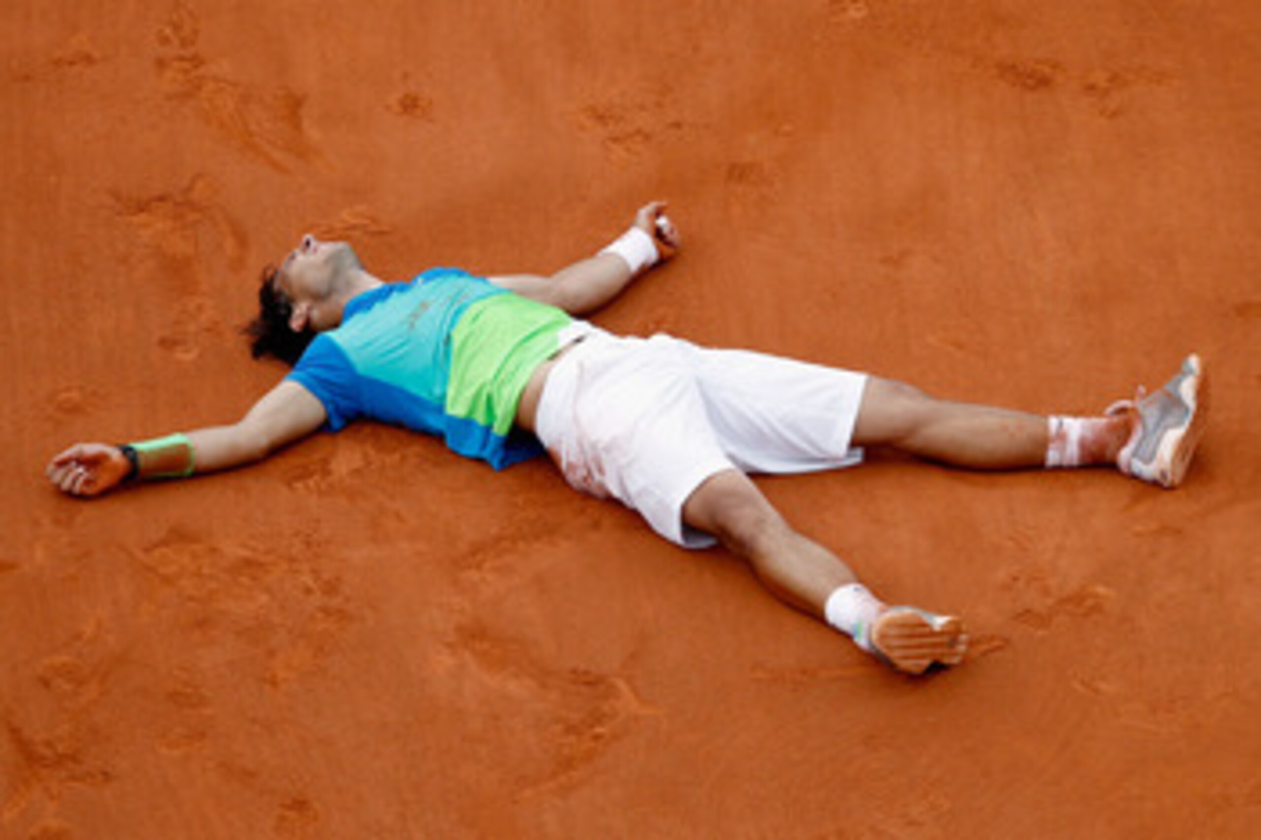 PARIS - JUNE 06: Rafael Nadal of Spain celebrates winning championship point during the men's singles final match between Rafael Nadal of Spain and Robin Soderling of Sweden on day fifteen of the French Open at Roland Garros on June 6, 2010 in Paris, Fra PARIS - JUNE 06: Rafael Nadal of Spain celebrates winning championship point during the men's singles final match between Rafael Nadal of Spain and Robin Soderling of Sweden on day fifteen of the French Open at Roland Garros on June 6, 2010 in Paris, Fra