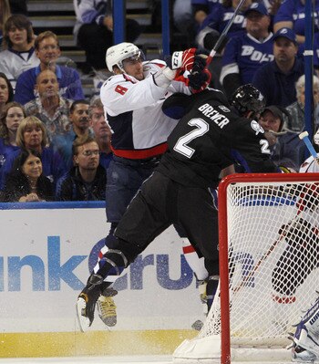 TAMPA, FL - MAY 03: Alex Ovechkin #8 of the Washington Capitals hits Eric Brewer #2 of the Tampa Bay Lightning in Game Three of the Eastern Conference Semifinals during the 2011 NHL Stanley Cup Playoffs at St Pete Times Forum on May 3, 2011 in Tampa, Flor