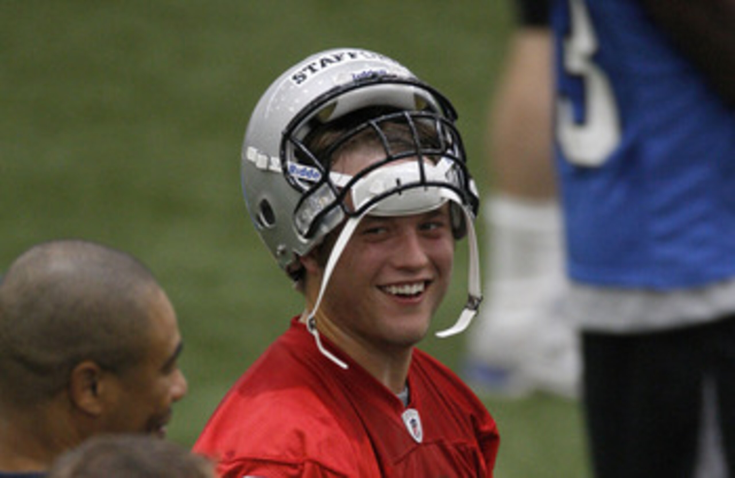 ALLEN PARK, MI - MAY 01:  Matt Stafford #9 of the Detroit Lions talks with teammates during rookie orientation camp at the Detroit Lions Headquarters and Training Facility on May 1, 2009 in Allen Park, Michigan.  (Photo by Gregory Shamus/Getty Images)