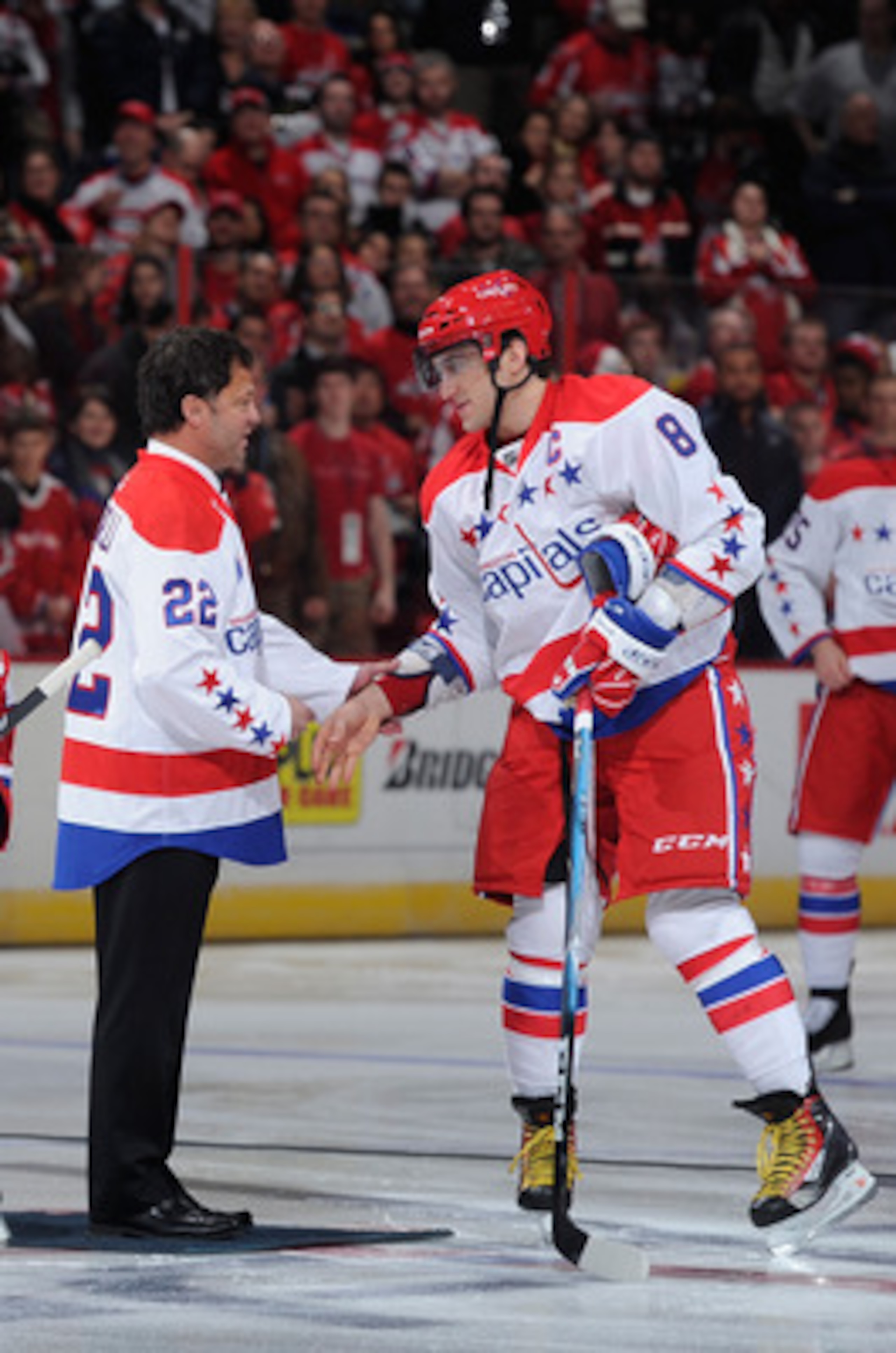 WASHINGTON, DC - FEBRUARY 01:  Former Washington Capital Dino Ciccarelli shakes hands with Alex Ovechkin #8 of the Washington Capitals before the game against the Montreal Canadiens at the Verizon Center on February 1, 2011 in Washington, DC.  (Photo by G