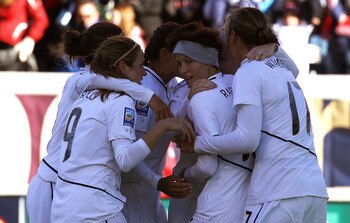 BRIDGEVIEW, IL - NOVEMBER 27: Members of the United States including (L-R) Heather O'Reilly #9, Megan Rapinoe #15 and Abby Wambach #17 celebrate a goal by teammate Amy Rodriquez against Italy during a Women's World Cup Qualifying match at Toyota Park on N