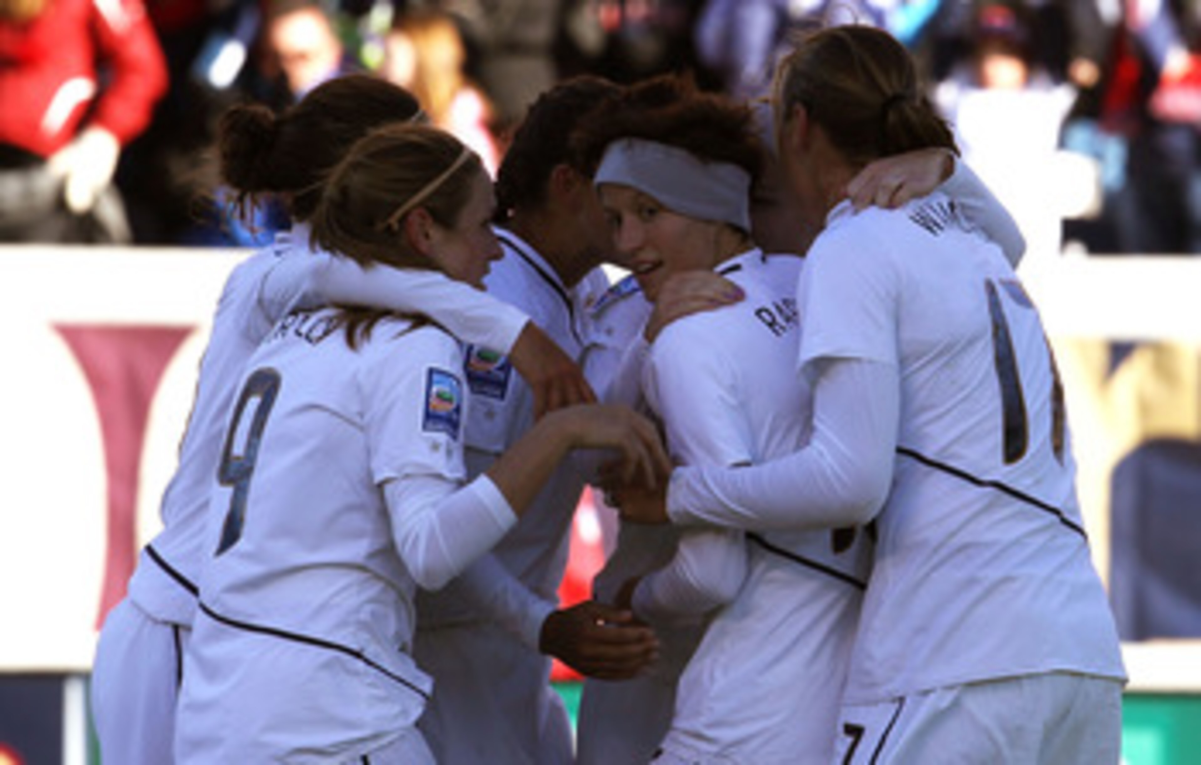 BRIDGEVIEW, IL - NOVEMBER 27: Members of the United States including (L-R) Heather O'Reilly #9, Megan Rapinoe #15 and Abby Wambach #17 celebrate a goal by teammate Amy Rodriquez against Italy during a Women's World Cup Qualifying match at Toyota Park on N BRIDGEVIEW, IL - NOVEMBER 27: Members of the United States including (L-R) Heather O'Reilly #9, Megan Rapinoe #15 and Abby Wambach #17 celebrate a goal by teammate Amy Rodriquez against Italy during a Women's World Cup Qualifying match at Toyota Park on N