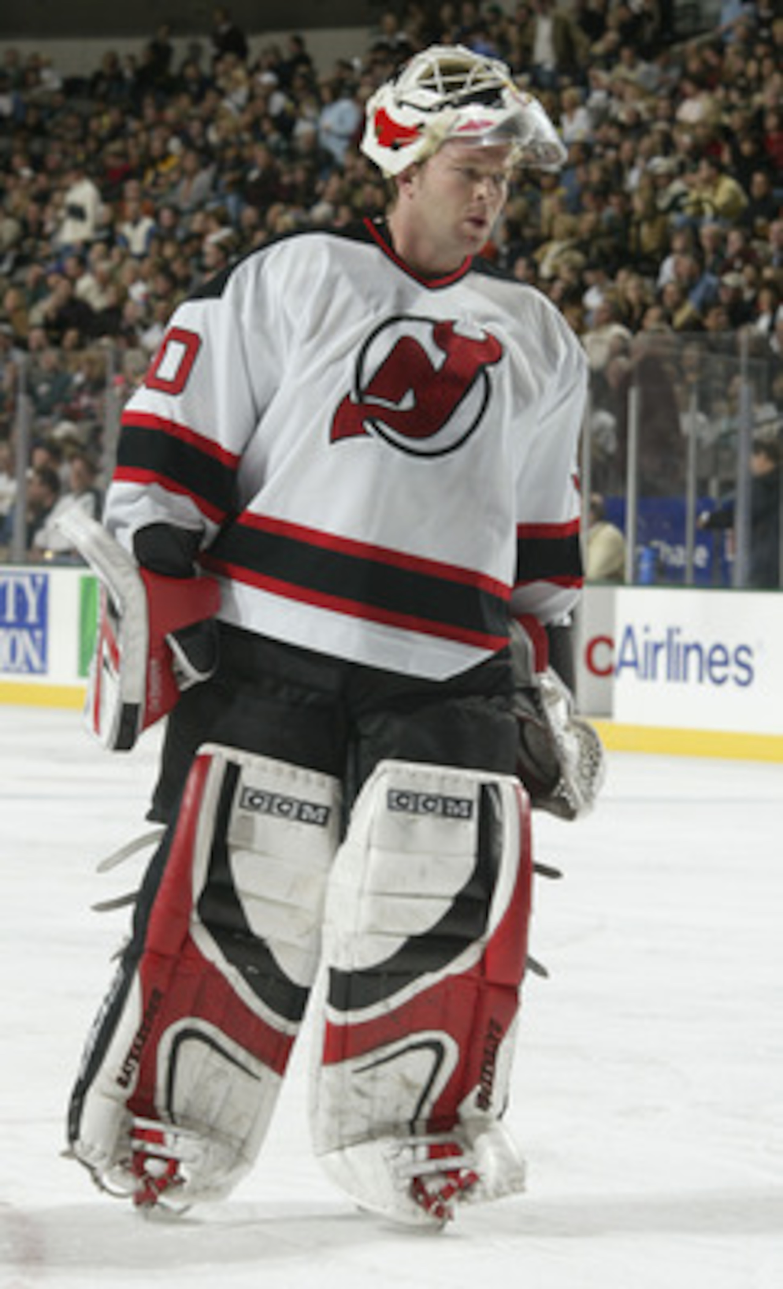 DALLAS - NOVEMBER 28:  Goalie Martin Brodeur #30 of the New Jersey Devils during the game against the Dallas Stars at the American Airlines Center on November 28, 2003 in Dallas, Texas. The Stars defeated the Devils 2-0. (Photo by Ronald Martinez/Getty Im