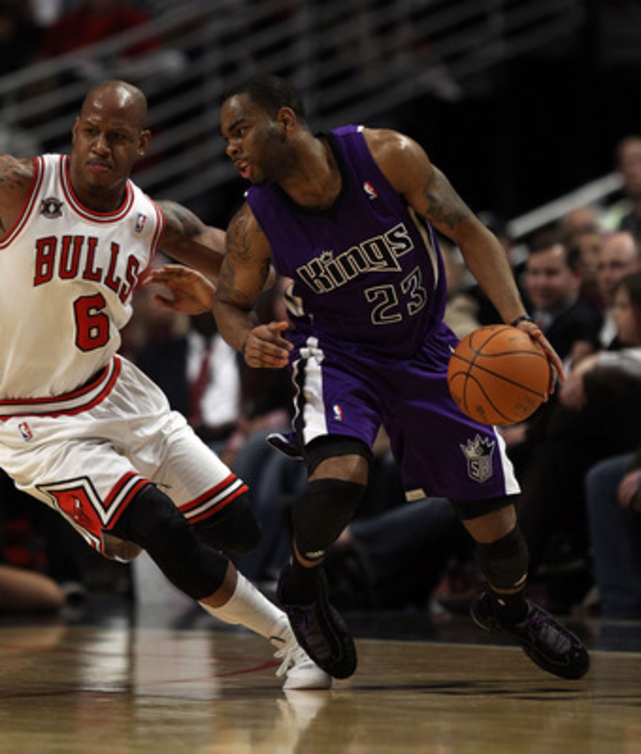 CHICAGO, IL - MARCH 21: Marcus Thornton #23 of the Sacramento Kings moves against Keith Bogans #6 of the Chicago Bulls at the United Center on March 21, 2011 in Chicago, Illinois. The Bulls defeated the Kings 132-92. NOTE TO USER: User expressly acknowled