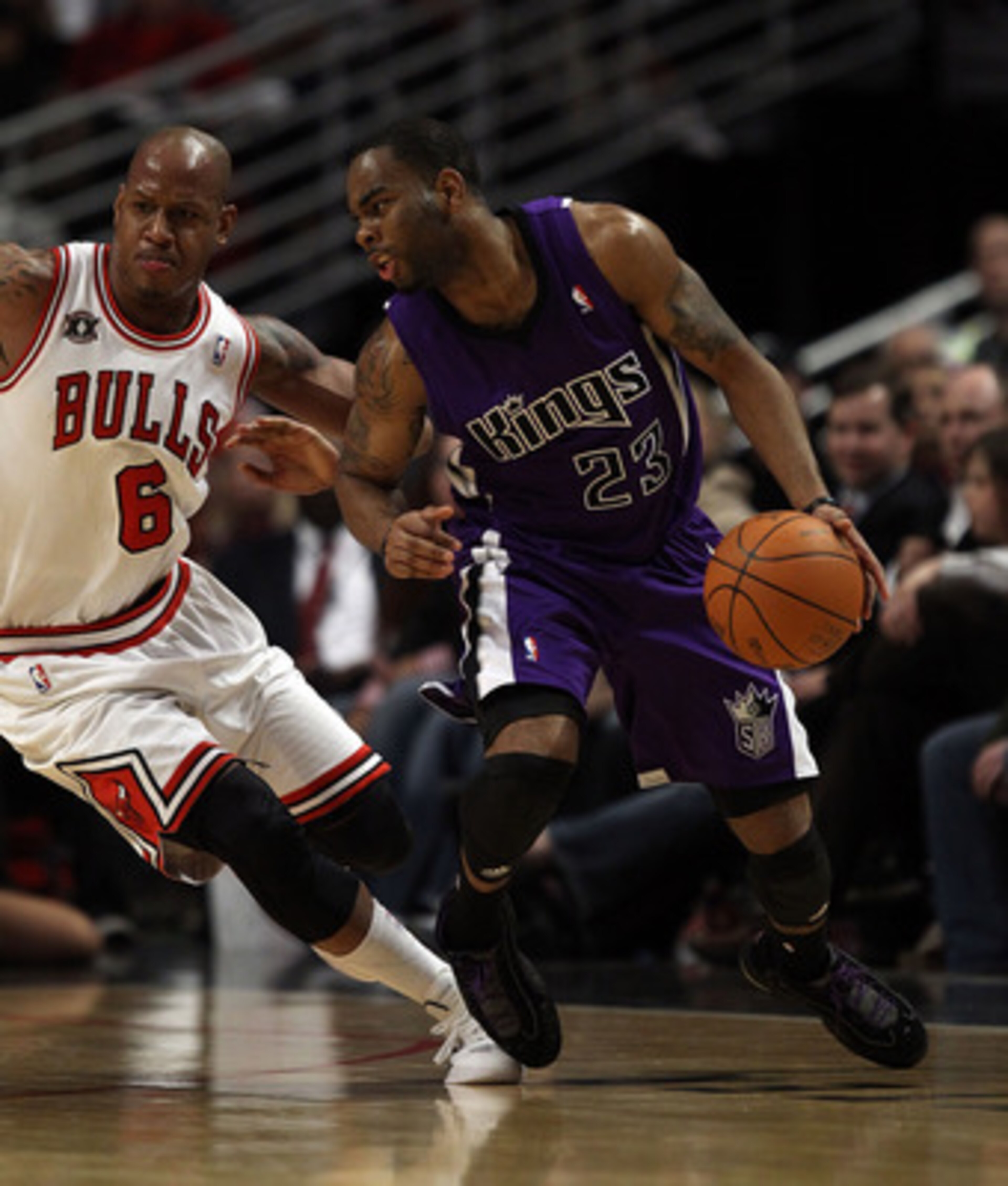 CHICAGO, IL - MARCH 21: Marcus Thornton #23 of the Sacramento Kings moves against Keith Bogans #6 of the Chicago Bulls at the United Center on March 21, 2011 in Chicago, Illinois. The Bulls defeated the Kings 132-92. NOTE TO USER: User expressly acknowled