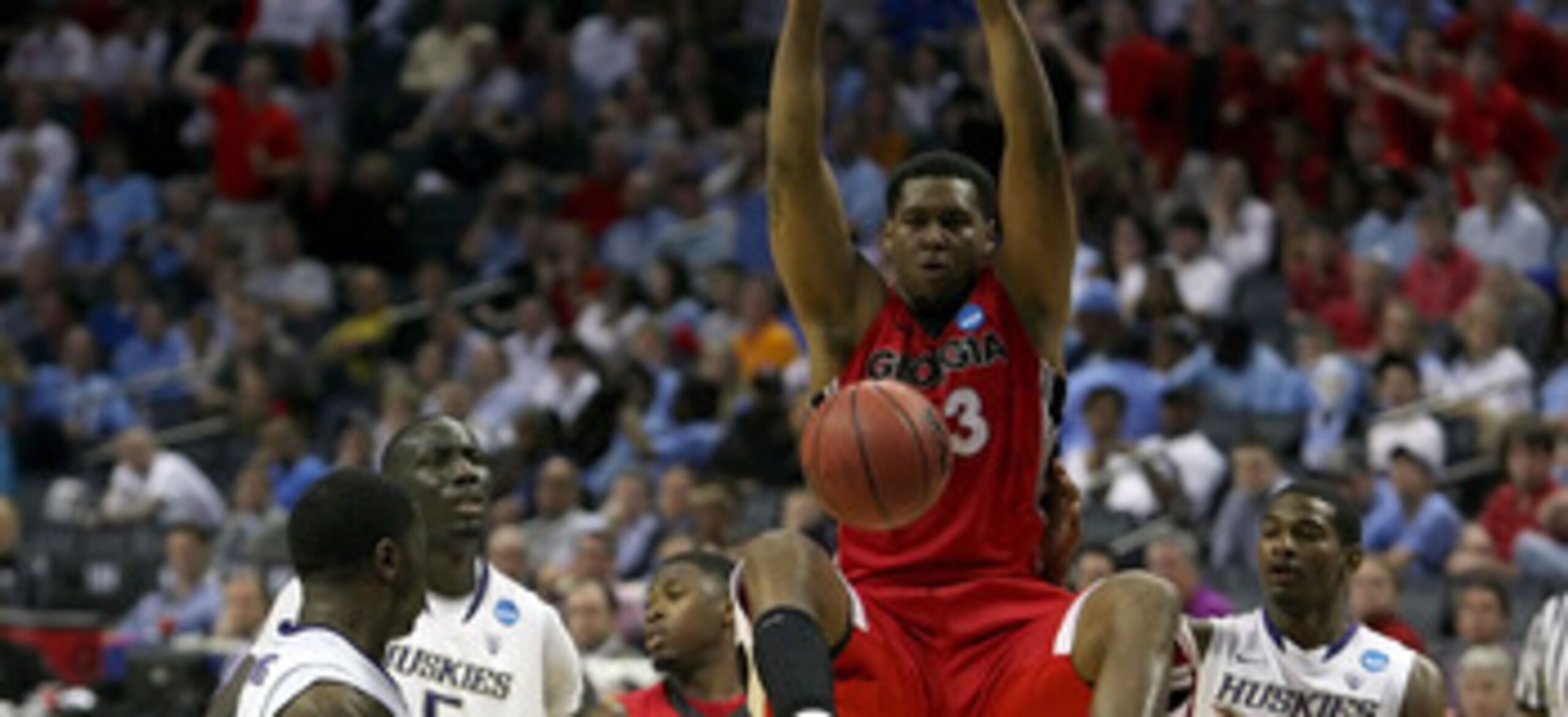 CHARLOTTE, NC - MARCH 18:  Trey Thompkins #33 of the Georgia Bulldogs dunks the ball while taking on the Washington Huskies during the second round of the 2011 NCAA men's basketball tournament at Time Warner Cable Arena on March 18, 2011 in Charlotte, Nor