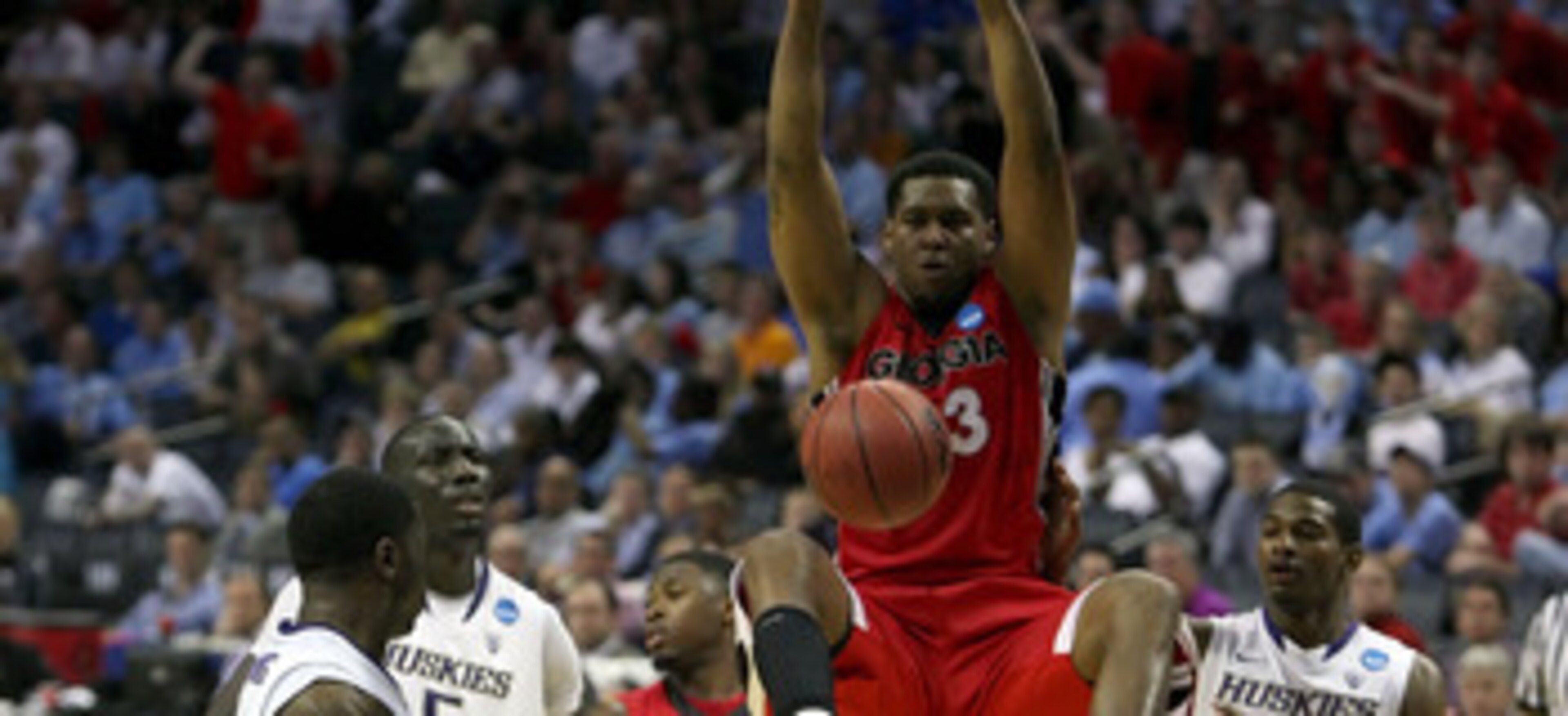 CHARLOTTE, NC - MARCH 18:  Trey Thompkins #33 of the Georgia Bulldogs dunks the ball while taking on the Washington Huskies during the second round of the 2011 NCAA men's basketball tournament at Time Warner Cable Arena on March 18, 2011 in Charlotte, Nor