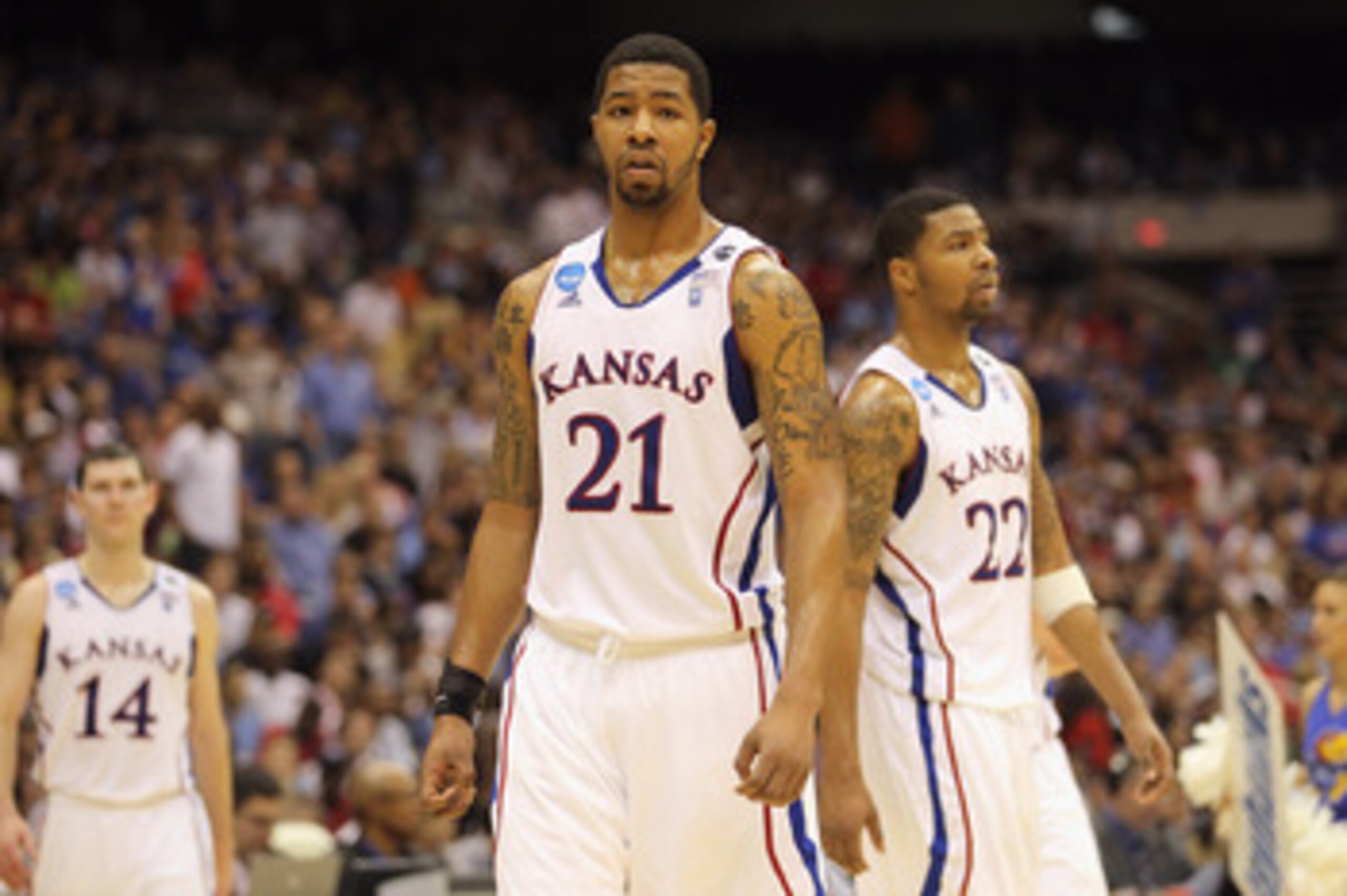 SAN ANTONIO, TX - MARCH 27:  Markieff Morris #21 and Marcus Morris #22 of the Kansas Jayhawks react during the southwest regional final of the 2011 NCAA men's basketball tournament against the Virginia Commonwealth Rams at the Alamodome on March 27, 2011 