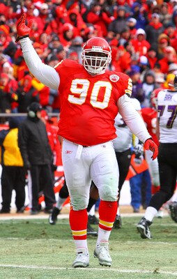 KANSAS CITY, MO - JANUARY 09:  Defensive tackle Shaun Smith #90 of the Kansas City Chiefs reacts against the Baltimore Ravens in the 2011 AFC wild card playoff game at Arrowhead Stadium on January 9, 2011 in Kansas City, Missouri.  (Photo by Dilip Vishwan