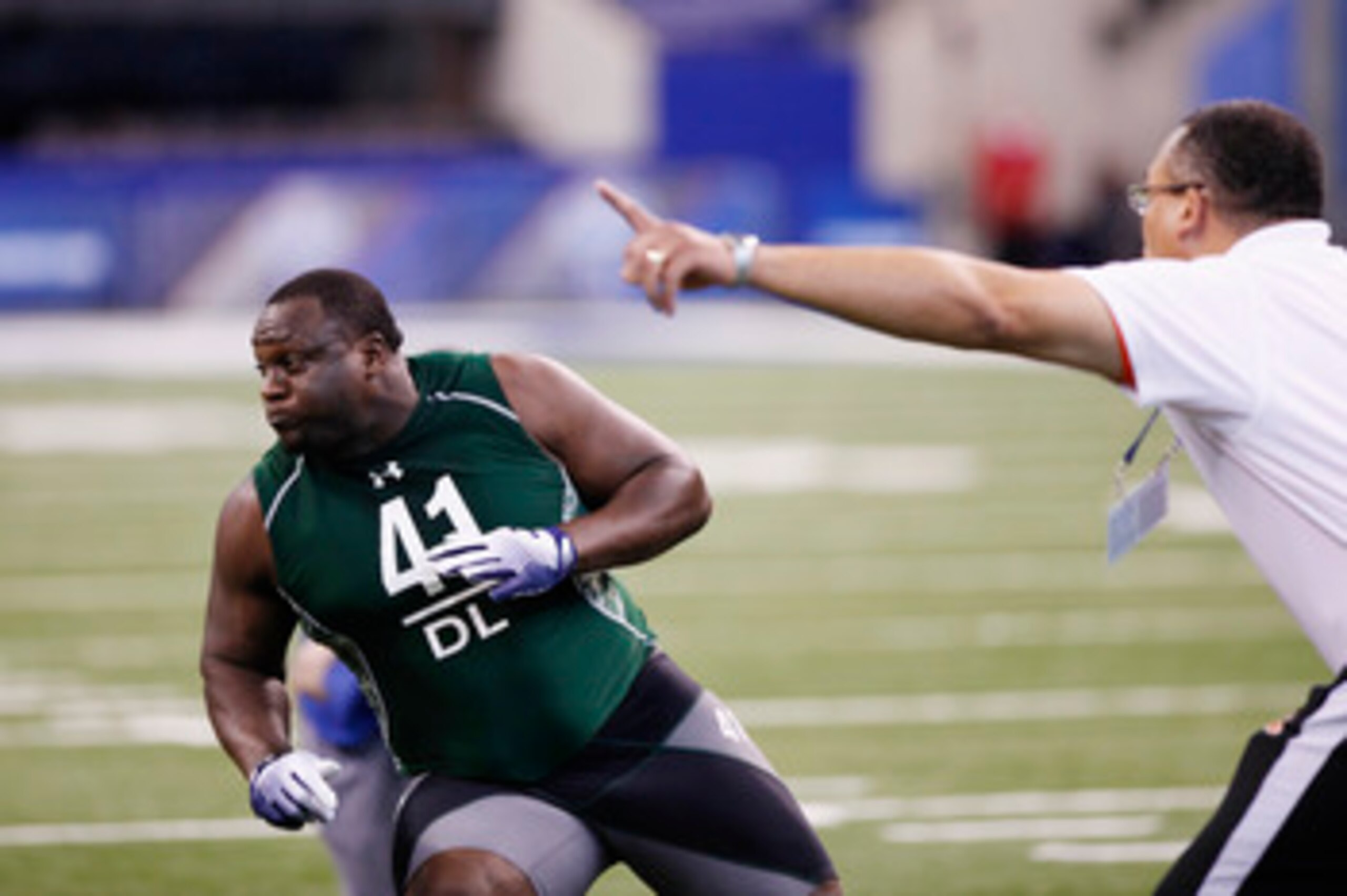 INDIANAPOLIS, IN - FEBRUARY 28: Defensive lineman Jerrell Powe of Mississippi runs through a drill during the 2011 NFL Scouting Combine at Lucas Oil Stadium on February 28, 2011 in Indianapolis, Indiana. (Photo by Joe Robbins/Getty Images)