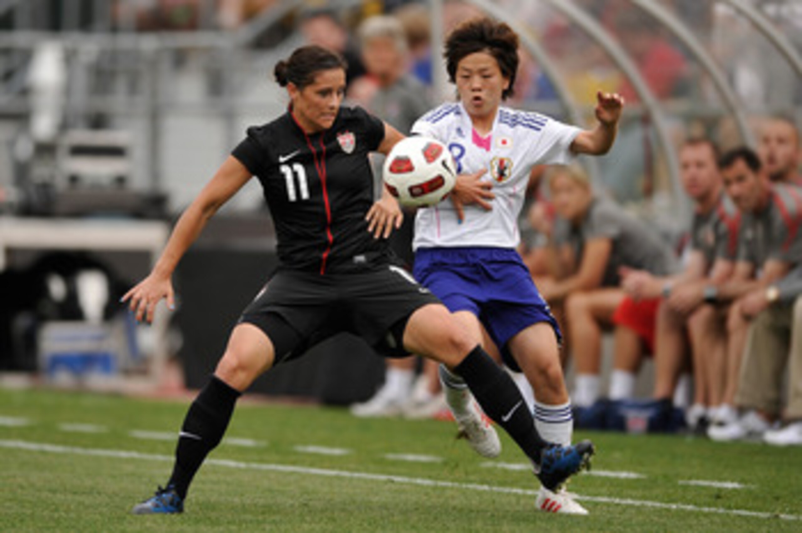 COLUMBUS, OH - MAY 14:  Ali Krieger #11 of the United States battle for control of the ball with Aya Miyama #8 of Japan on May 14, 2011 at Crew Stadium in Columbus, Ohio.  (Photo by Jamie Sabau/Getty Images)
