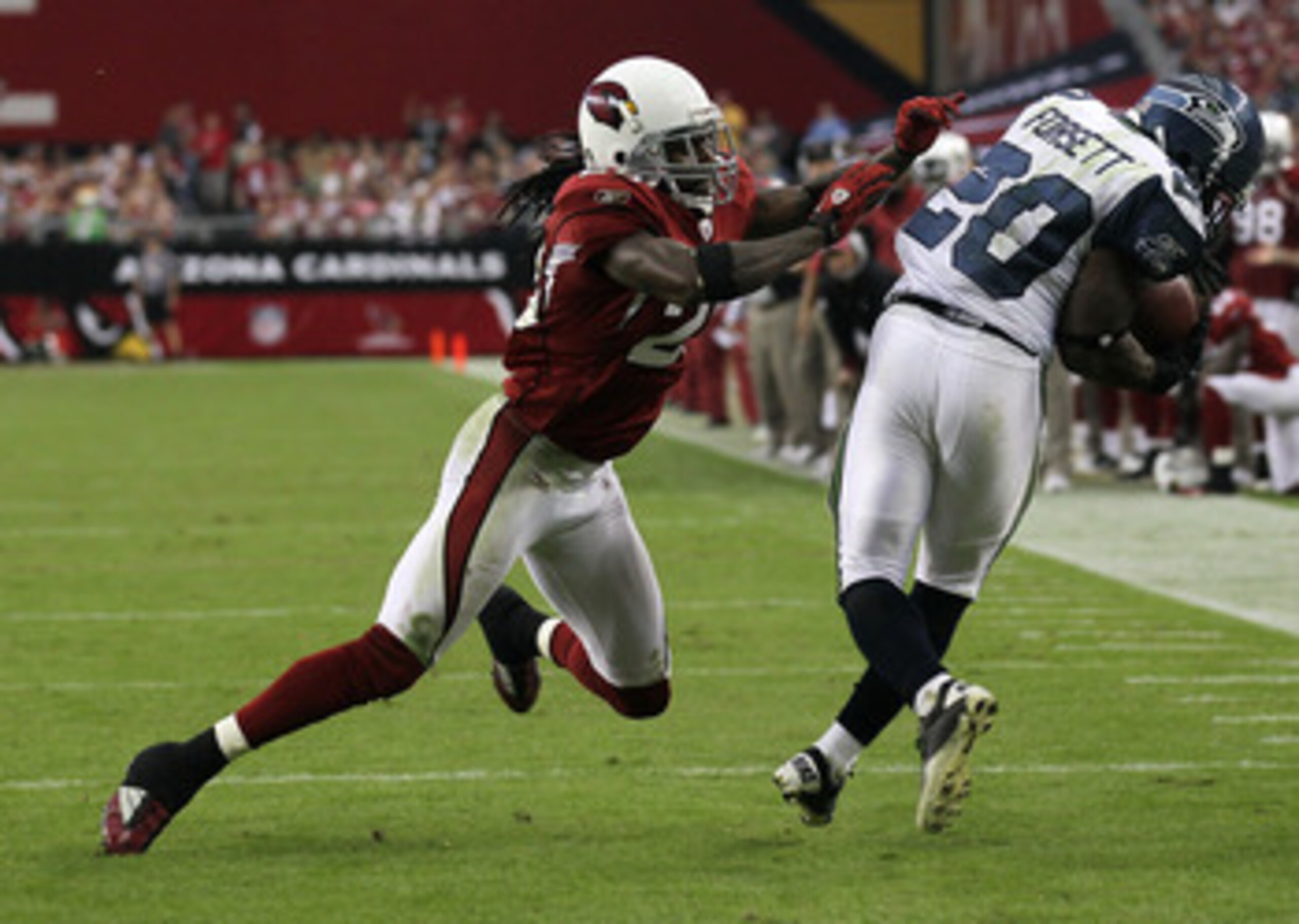 GLENDALE, AZ - NOVEMBER 14:   Cornerback Greg Toler #28 of the Arizona Cardinals knocks down running back Justin Forsett #20 of the Seattle Seahawks after a pass reception at University of Phoenix Stadium on November 14, 2010 in Glendale, Arizona. Seattle