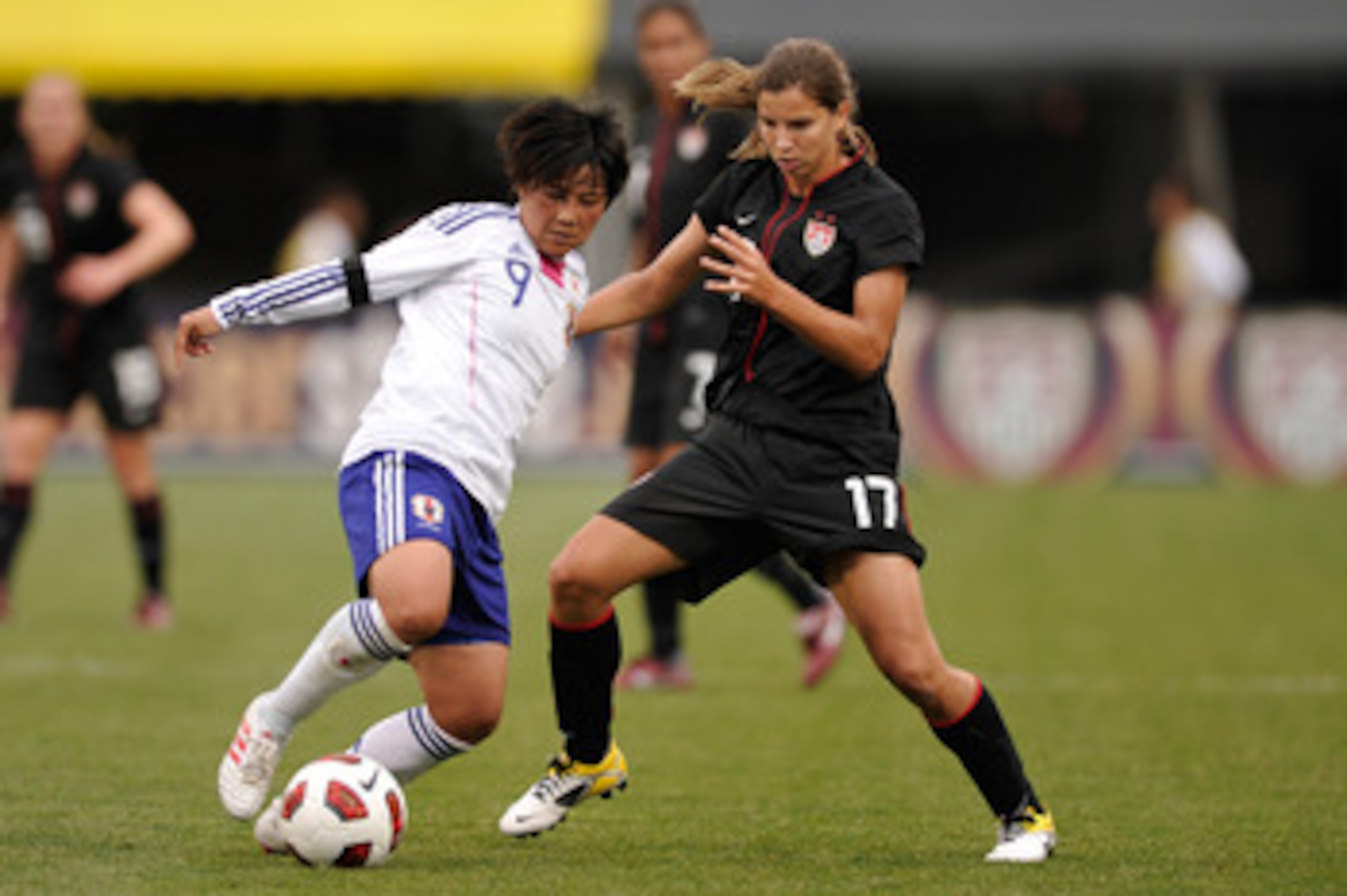 COLUMBUS, OH - MAY 14:  Shinobu Ohno #9 of Japan controls the ball as Tobin Heath #17 of the United States defends on May 14, 2011 at Crew Stadium in Columbus, Ohio.  (Photo by Jamie Sabau/Getty Images)