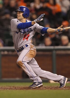 SAN FRANCISCO, CA - APRIL 11:  Jamey Carroll #14 of the Los Angeles Dodgers singles in the fifth inning against the San Francisco Giants during an MLB game at AT&T Park on April 11, 2011 in San Francisco, California.  (Photo by Jed Jacobsohn/Getty Images)