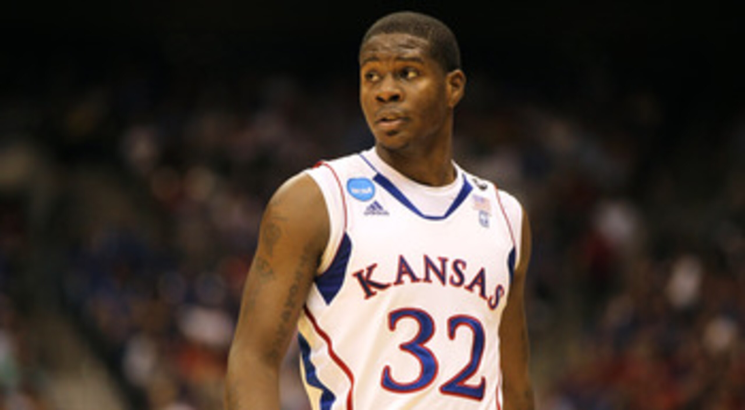 SAN ANTONIO, TX - MARCH 25:  Josh Selby #32 of the Kansas Jayhawks looks on during the southwest regional of the 2011 NCAA men's basketball tournament against the Richmond Spiders at the Alamodome on March 25, 2011 in San Antonio, Texas. Kansas defeated R