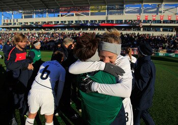 BRIDGEVIEW, IL - NOVEMBER 27: Amy Rodriguez #8 of the United States gets a hug from a teammate after scoring the only goal of the match against Italy during a Women's World Cup Qualifying match at Toyota Park on November 27, 2010 in Bridgeview, Illinois. 