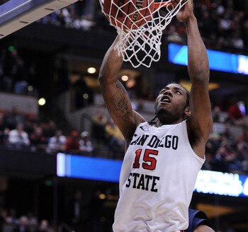 ANAHEIM, CA - MARCH 24:  Kawhi Leonard #15 of the San Diego State Aztecs dunks the ball against the Connecticut Huskies during the west regional semifinal of the 2011 NCAA men's basketball tournament at the Honda Center on March 24, 2011 in Anaheim, Calif