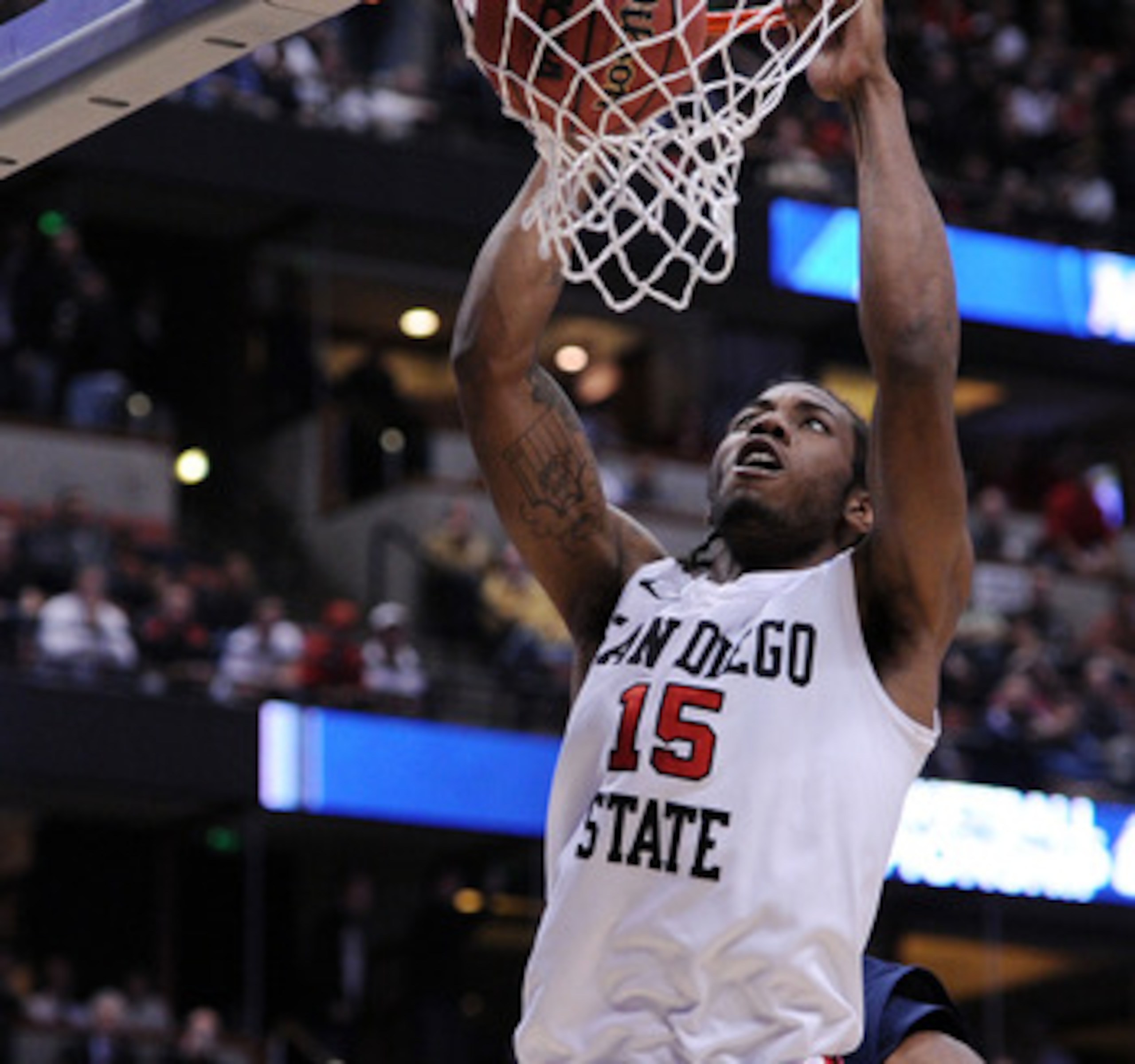 ANAHEIM, CA - MARCH 24:  Kawhi Leonard #15 of the San Diego State Aztecs dunks the ball against the Connecticut Huskies during the west regional semifinal of the 2011 NCAA men's basketball tournament at the Honda Center on March 24, 2011 in Anaheim, Calif