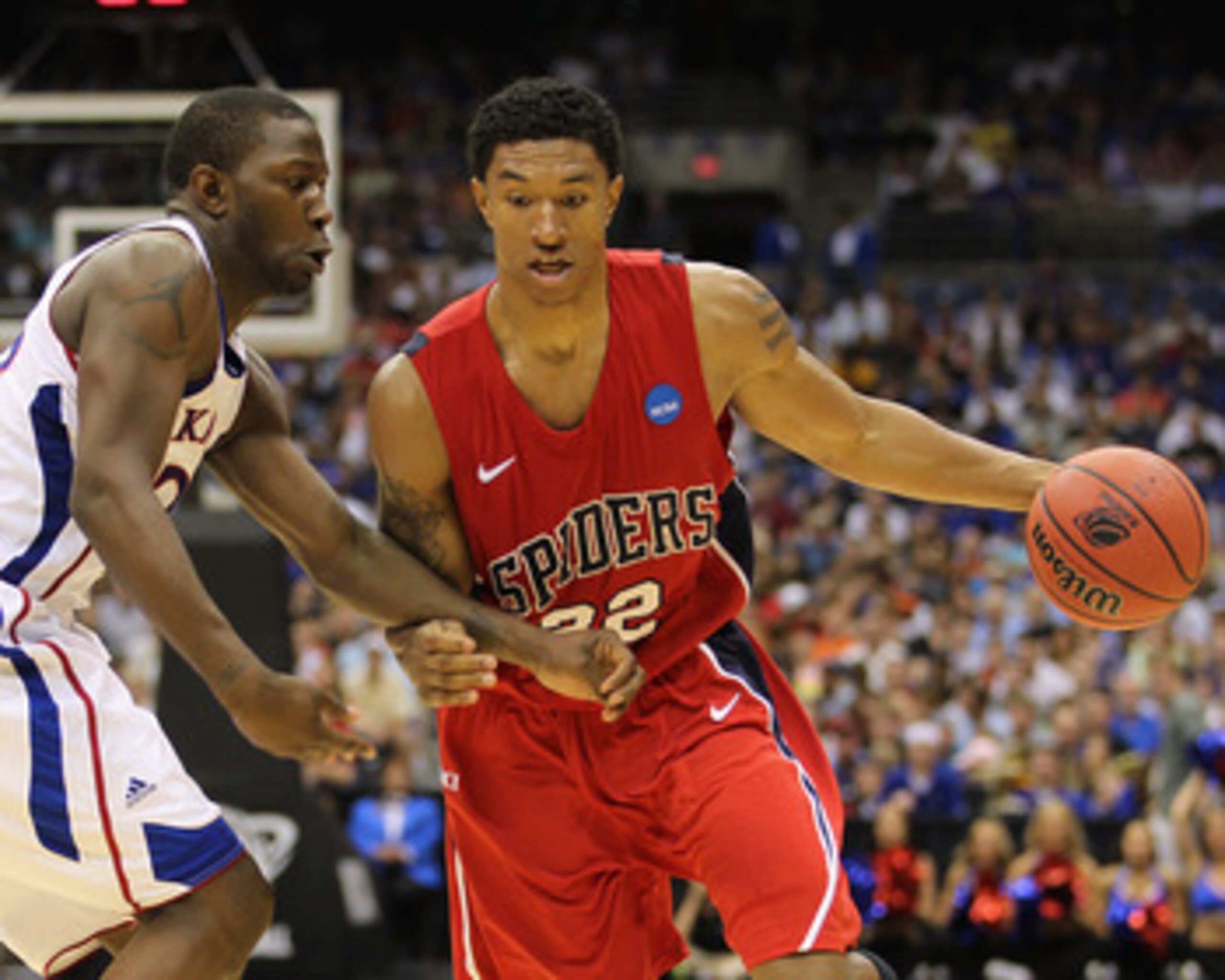 SAN ANTONIO, TX - MARCH 25:  Justin Harper #32 of the Richmond Spiders drives against the Kansas Jayhawks during the southwest regional of the 2011 NCAA men's basketball tournament at the Alamodome on March 25, 2011 in San Antonio, Texas. Kansas defeated 
