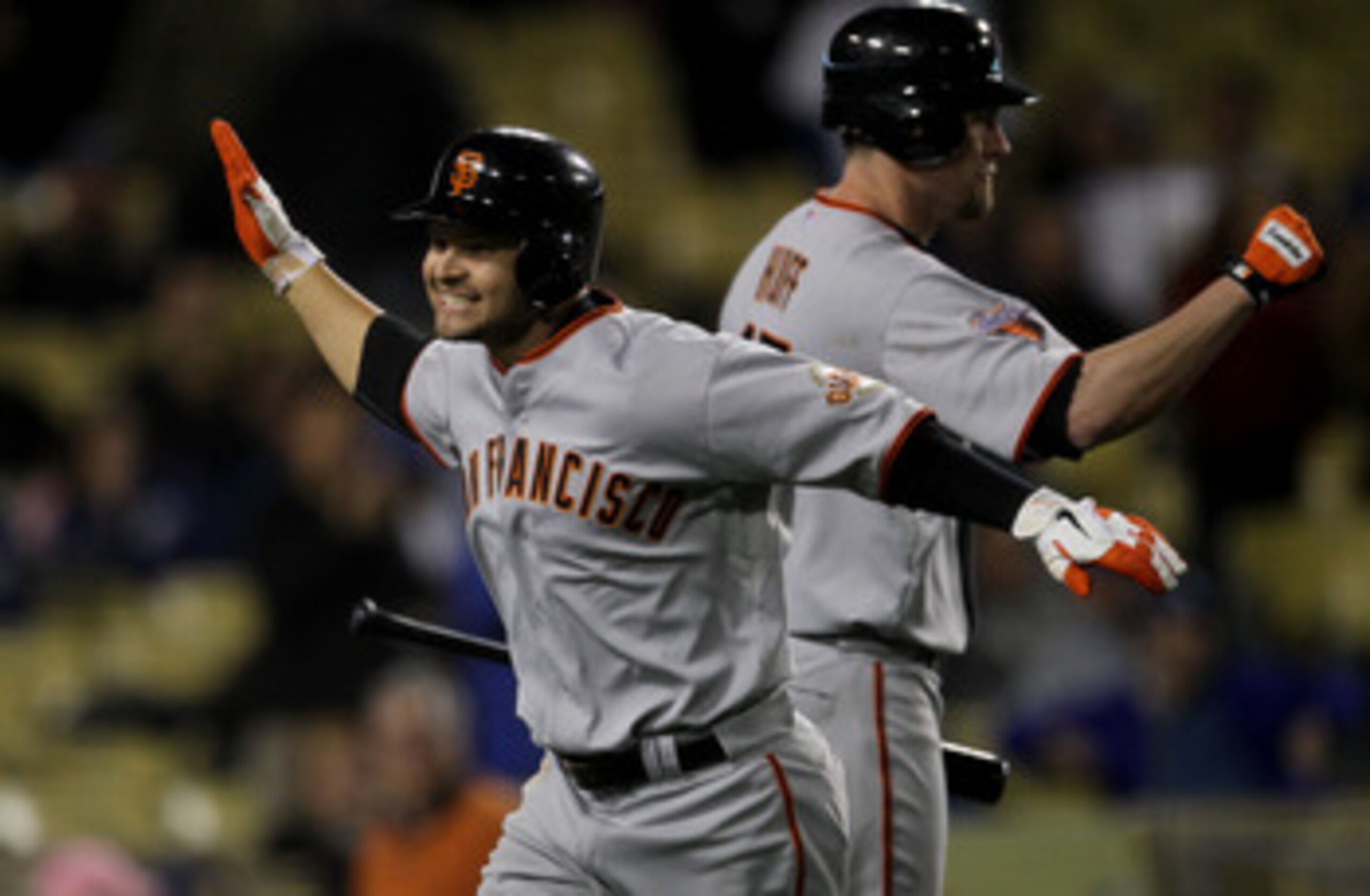 LOS ANGELES, CA - MAY 18:  Cody Ross #13 of the San Francisco Giants celebrates after hitting a three run home run in the ninth inning against the Los Angeles Dodgers on May 18, 2011 at Dodger Stadium in Los Angeles, California.  (Photo by Stephen Dunn/Ge