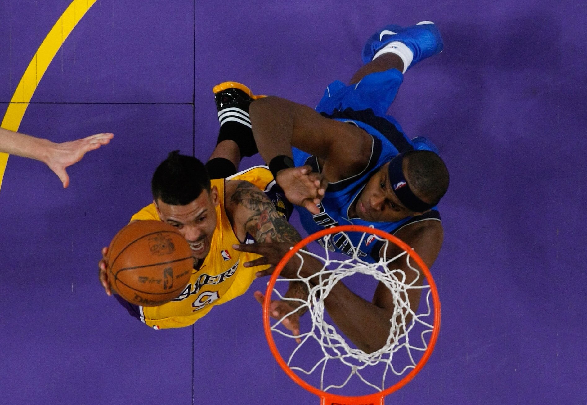 LOS ANGELES, CA - MAY 02:  Matt Barnes #9 of the Los Angeles Lakers goes up for a shot under the basket against Brendan Haywood #33 of the Dallas Mavericks in Game One of the Western Conference Semifinals in the 2011 NBA Playoffs at Staples Center on May 