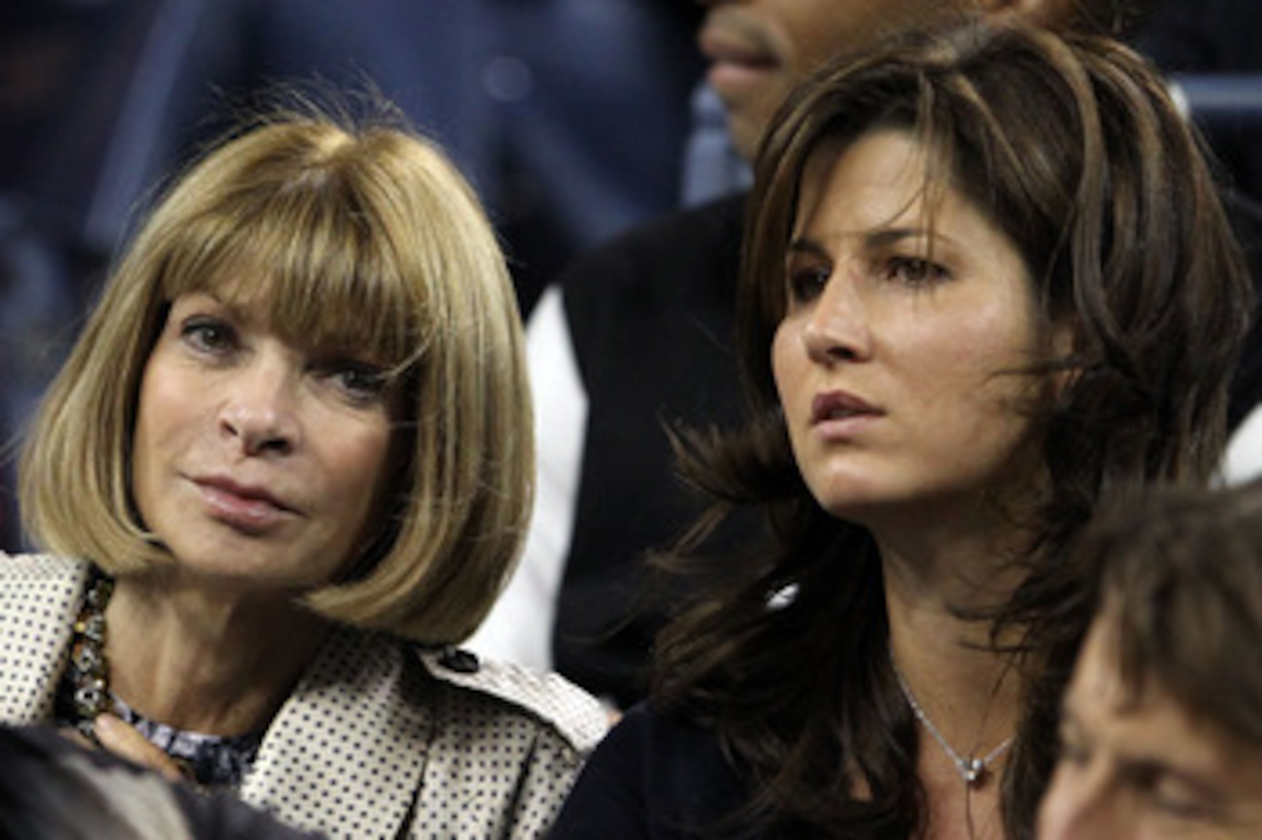 NEW YORK - SEPTEMBER 08:  (L-R) Anna Wintour and Mirka Federer look on as Robin Soderling of Sweden plays against Roger Federer of Switzerland during their men's singles quarterfinal match on day ten of the 2010 U.S. Open at the USTA Billie Jean King Nati