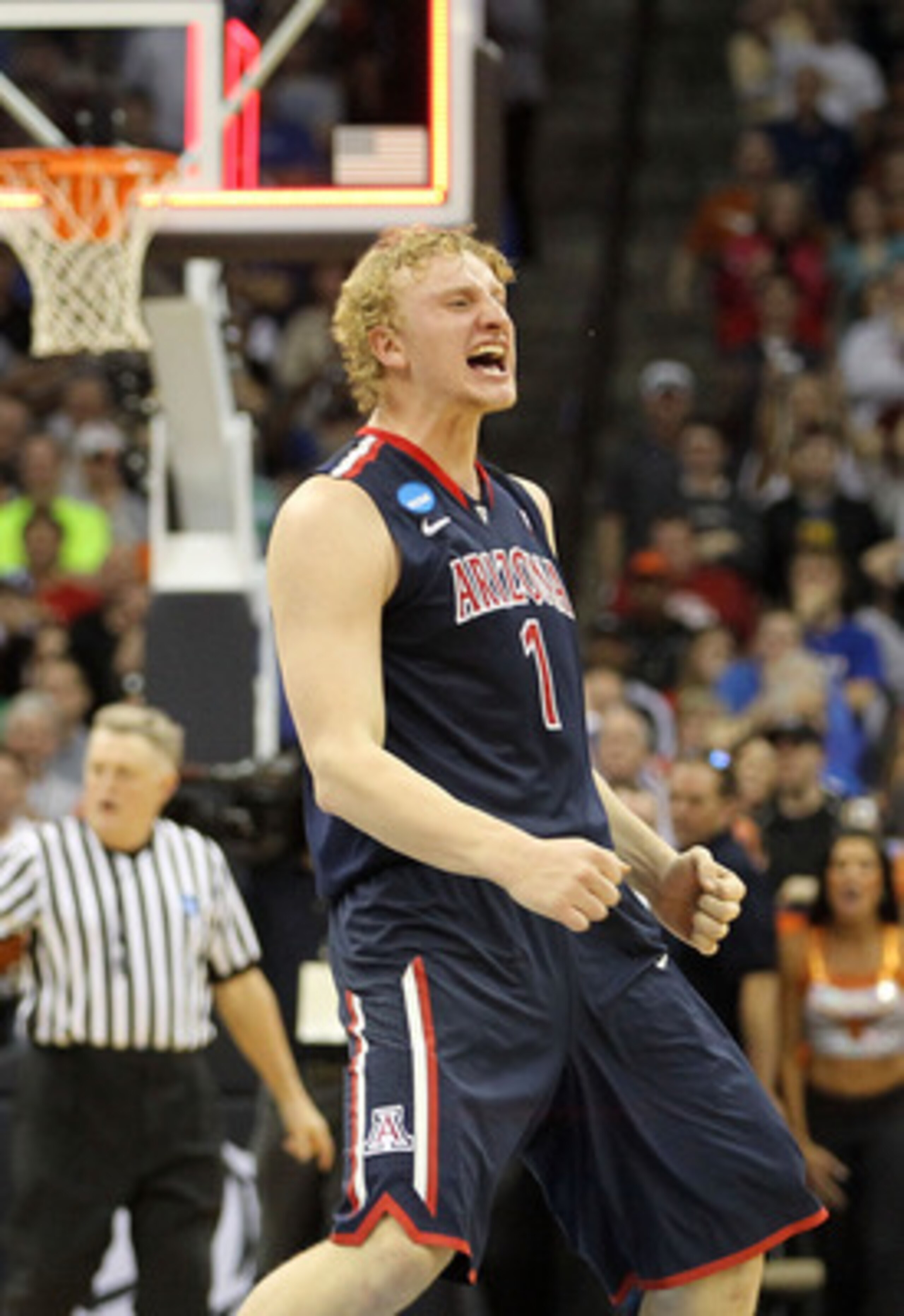 TULSA, OK - MARCH 20: Kyryl Natyazhko #1 of the Arizona Wildcats celebrates after defeating the Texas Longhorns 70-69 in the third round of the 2011 NCAA men's basketball tournament at BOK Center on March 20, 2011 in Tulsa, Oklahoma. (Photo by Ronald Ma TULSA, OK - MARCH 20: Kyryl Natyazhko #1 of the Arizona Wildcats celebrates after defeating the Texas Longhorns 70-69 in the third round of the 2011 NCAA men's basketball tournament at BOK Center on March 20, 2011 in Tulsa, Oklahoma. (Photo by Ronald Ma