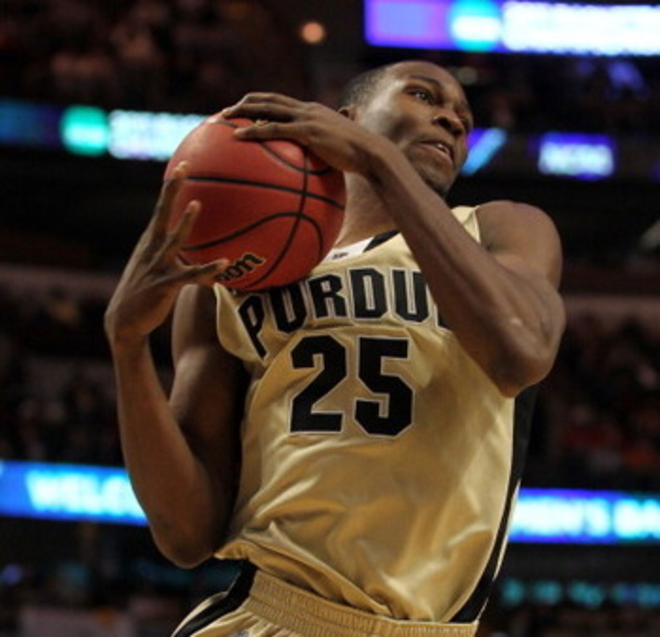CHICAGO, IL - MARCH 20:  JaJuan Johnson #25 of the Purdue Boilermakers rebounds against the Virginia Commonwealth Rams n the first half during the third round of the 2011 NCAA men's basketball tournament at the United Center on March 20, 2011 in Chicago, 