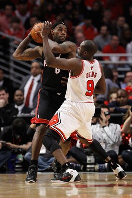 CHICAGO, IL - MAY 15: LeBron James #6 of the Miami Heat looks to pass against the defense of Luol Deng #9 of the Chicago Bulls in Game One of the Eastern Conference Finals during the 2011 NBA Playoffs on May 15, 2011 at the United Center in Chicago, Illin