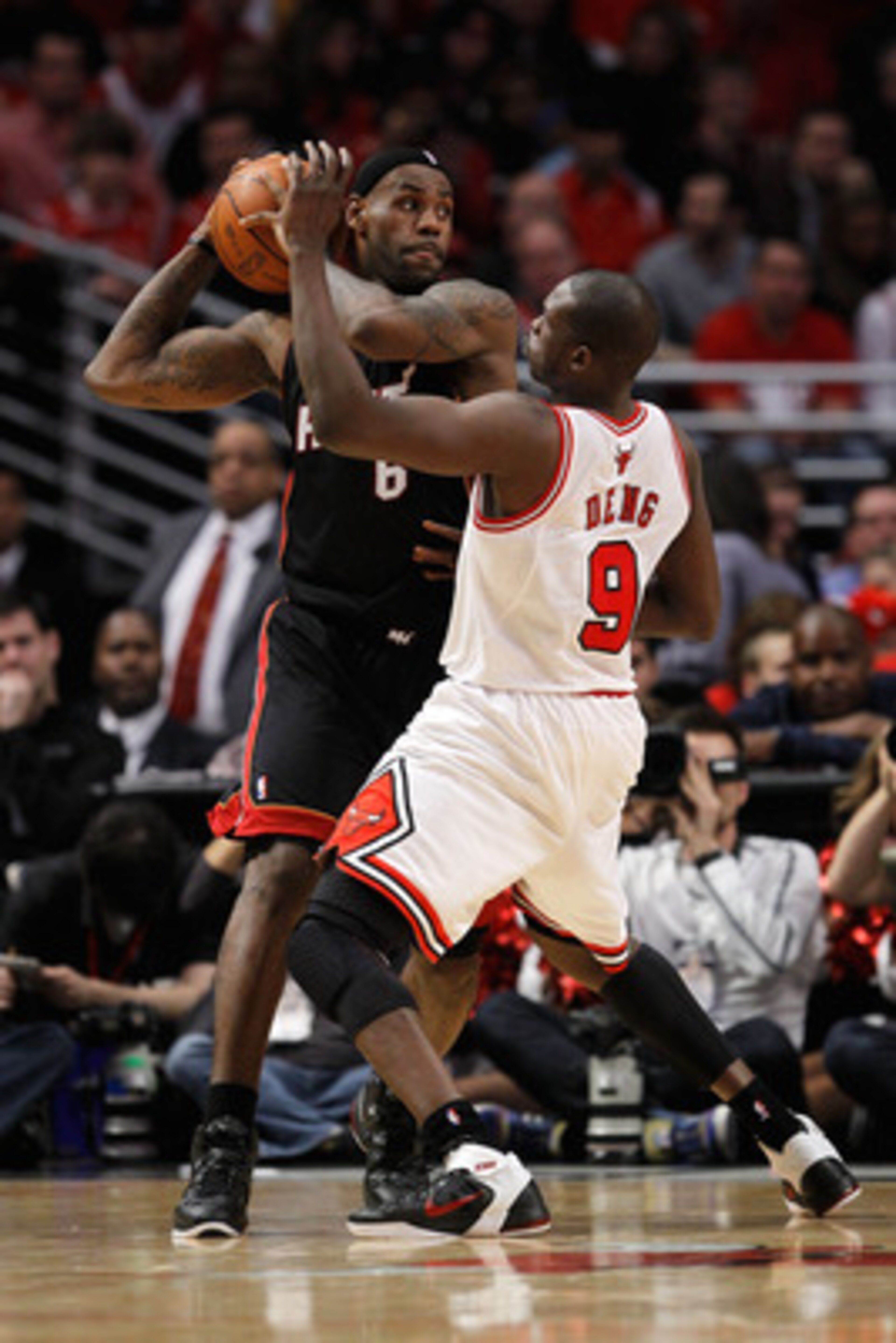 CHICAGO, IL - MAY 15: LeBron James #6 of the Miami Heat looks to pass against the defense of Luol Deng #9 of the Chicago Bulls in Game One of the Eastern Conference Finals during the 2011 NBA Playoffs on May 15, 2011 at the United Center in Chicago, Illin CHICAGO, IL - MAY 15: LeBron James #6 of the Miami Heat looks to pass against the defense of Luol Deng #9 of the Chicago Bulls in Game One of the Eastern Conference Finals during the 2011 NBA Playoffs on May 15, 2011 at the United Center in Chicago, Illin