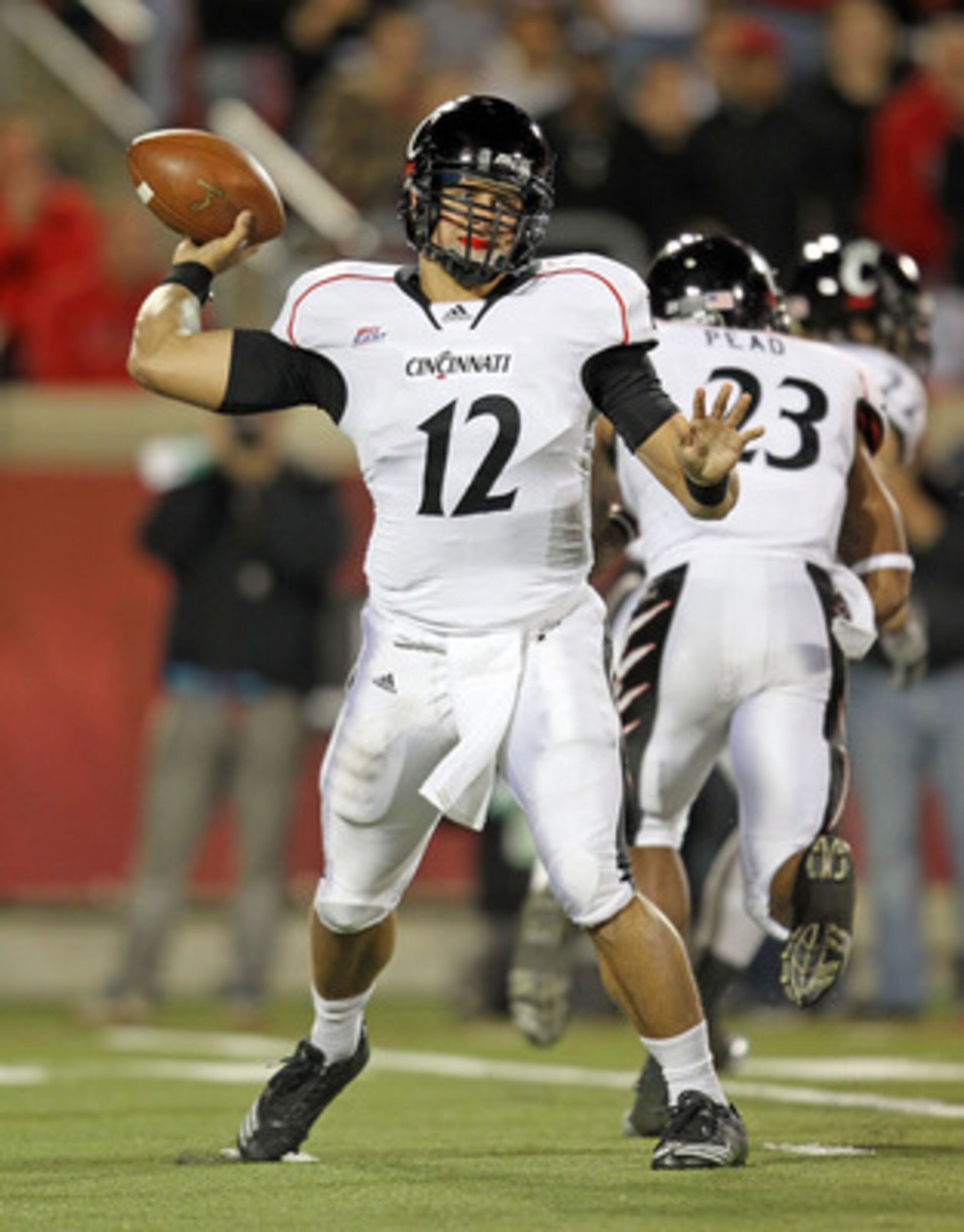 LOUISVILLE, KY - OCTOBER 15:  Zach Collaros #12 of the Cincinnati Bearcats throws a pass during the Big East Conference game against the Louisville Cardinals at Papa John's Cardinal Stadium on October 15, 2010 in Louisville, Kentucky.  (Photo by Andy Lyon