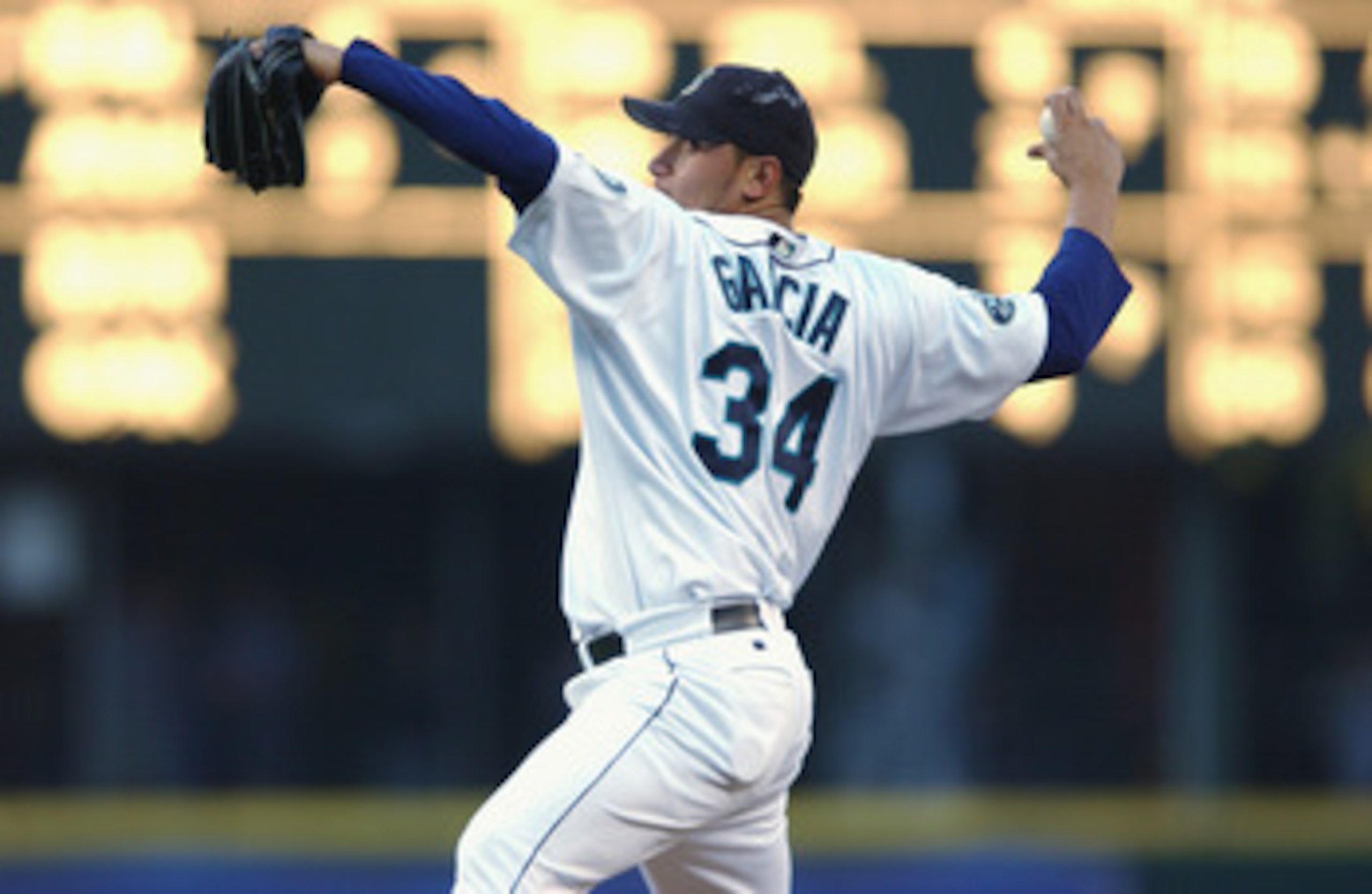 SEATTLE - AUGUST 30:  Pitcher Freddy Garcia #34 of the Seattle Mariners throws a pitch during the MLB game against the Kansas City Royals on August 30, 2002 at Safeco Field in Seattle, Washington.  The Royals defeated Mariners 5-1.  (Photo by Otto Greule 