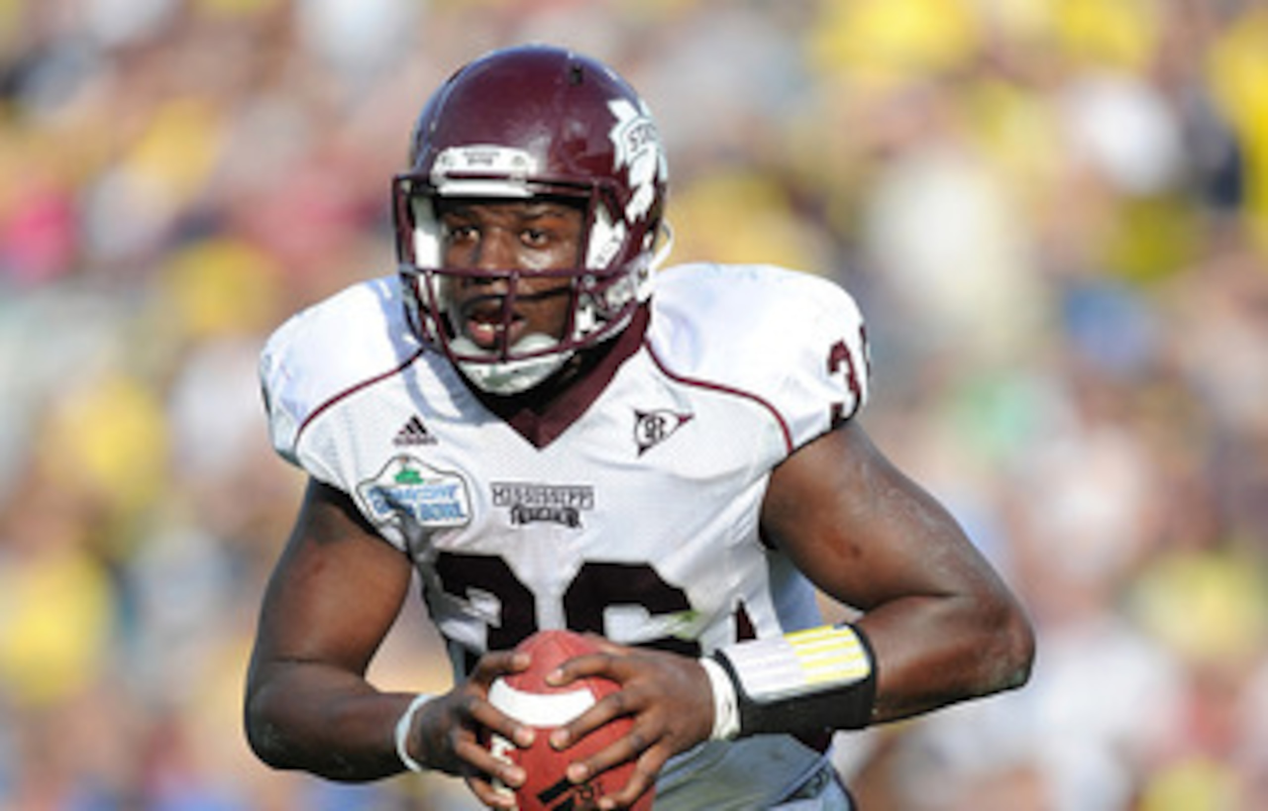 JACKSONVILLE, FL - JANUARY 01:  Quarterback Chris Relf #36 of the Mississippi State Bulldogs rushes against the Michigan Wolverines during the Gator Bowl at EverBank Field on January 1, 2011 in Jacksonville, Florida  (Photo by Rick Dole/Getty Images)