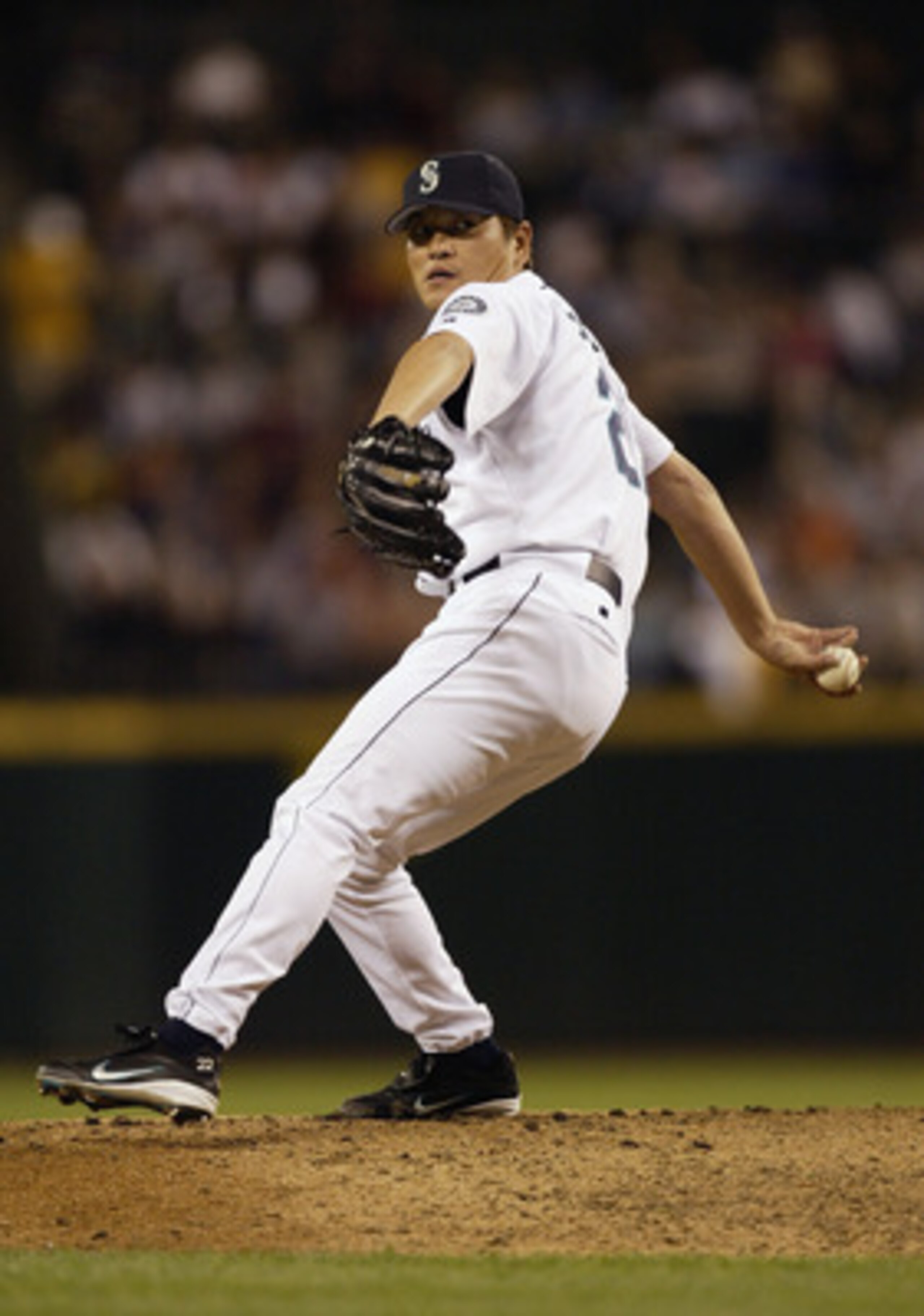 SEATTLE - AUGUST 13:  Kazuhiro Sasaki #22 of the Seattle Mariners pitches against the Toronto Blue Jays in the eighth inning of the game on August 13, 2003 at Safeco Field in Seattle, Washington.  Sasaki retired the side in order as the Mariners defeated 