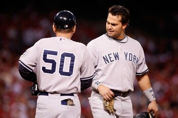 ANAHEIM, CA - OCTOBER 20:  Nick Swisher #33 (R) of the New York Yankees talks with first base coach Mick Kelleher in Game Four of the ALCS against the Los Angeles Angels of Anaheim during the 2009 MLB Playoffs at Angel Stadium on October 20, 2009 in Anahe