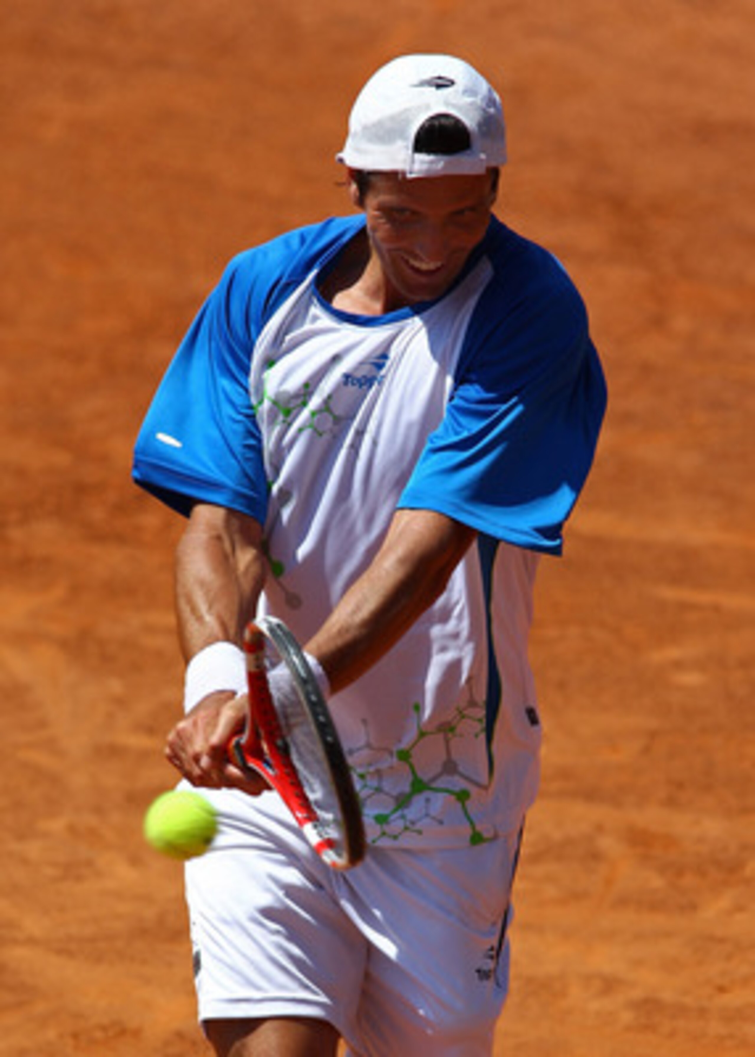 ROME, ITALY - MAY 10:  Juan Ignacio Chela of Argentina hits a backhand return during his first round match against John Isner of USA during day three of the Internazionali BNL d'Italia at the Foro Italico Tennis Centre on May 10, 2011 in Rome, Italy.  (Ph