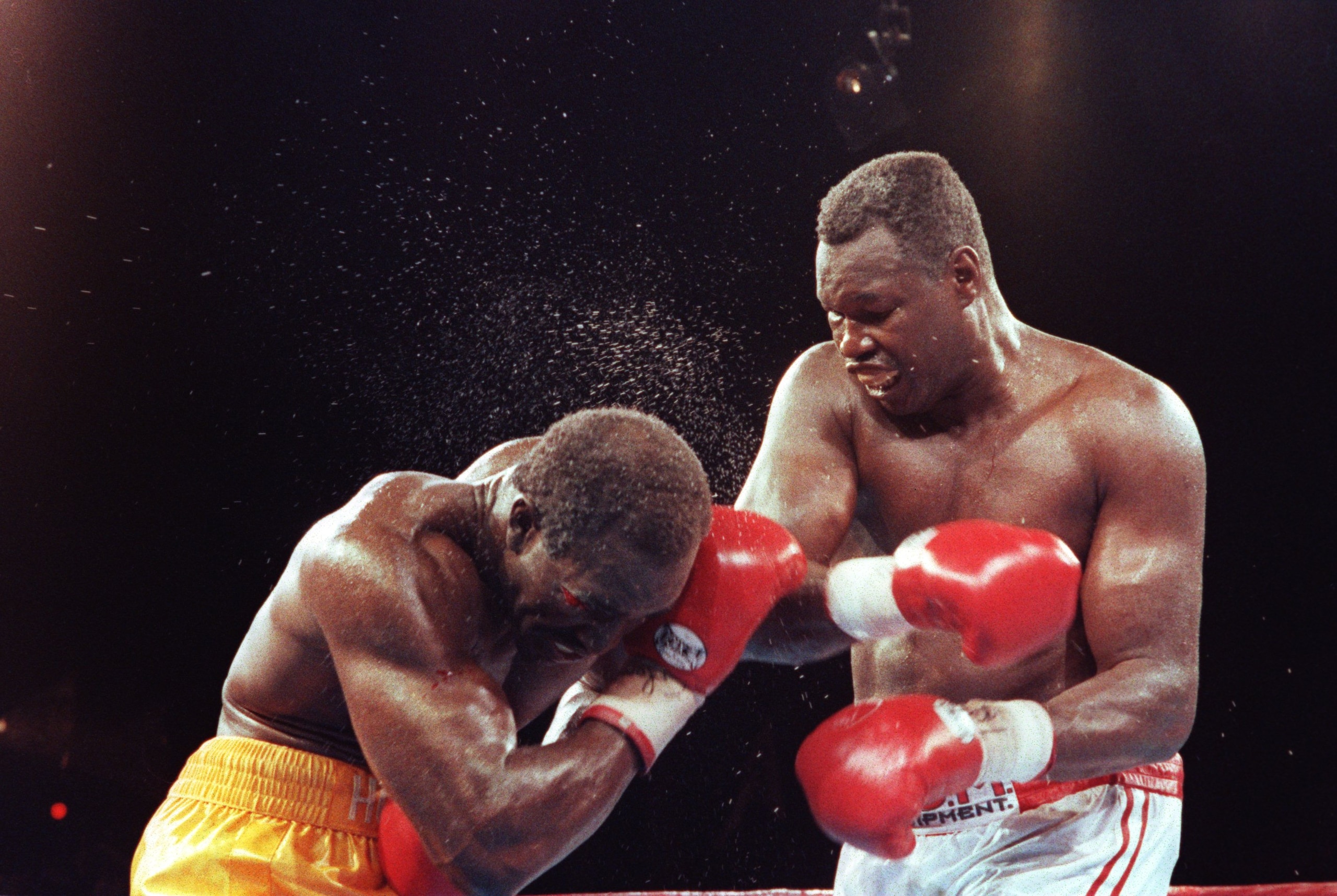 19 JUN 1992:  HEAVYWEIGHT BOXER LARRY HOLMES DELIVERS A RIGHT CROSS TO WORLD CHAMPIONN EVANDER HOLYFIELD DURING THEIR TITLE BOUT IN LAS VEGAS, NEVADA.  Mandatory Credit: Holly Stein/ALLSPORT