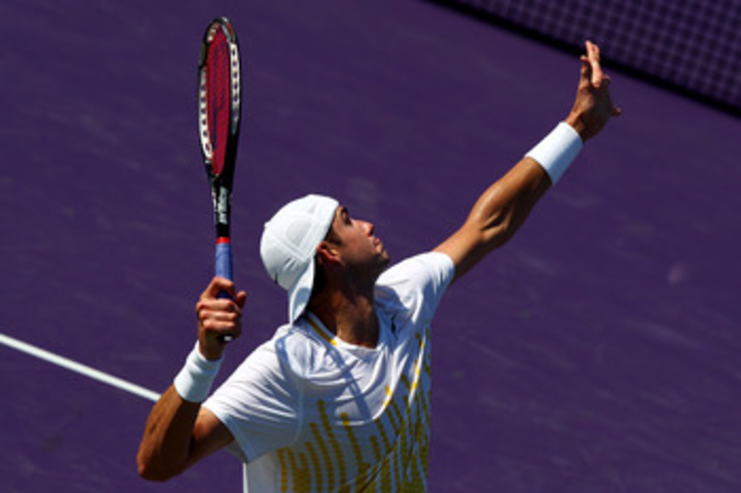 KEY BISCAYNE, FL - MARCH 27:  John Isner serves against Alex Bogomolov Jr. during the Sony Ericsson Open at Crandon Park Tennis Center on March 27, 2011 in Key Biscayne, Florida.  (Photo by Clive Brunskill/Getty Images)