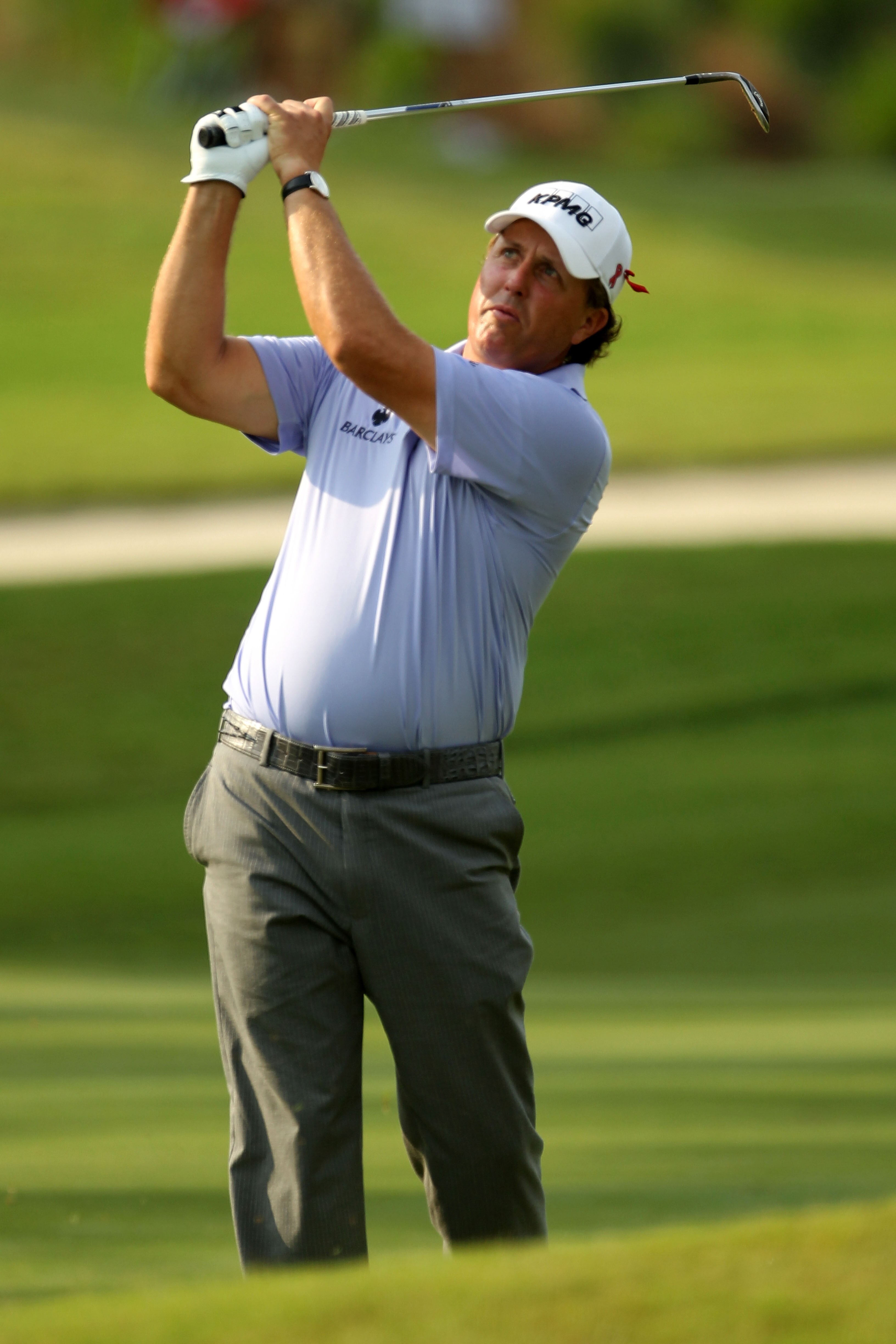 PONTE VEDRA BEACH, FL - MAY 13:  Phil Mickelson hits from the rough on the 12th hole during the second round of THE PLAYERS Championship held at THE PLAYERS Stadium course at TPC Sawgrass on May 13, 2011 in Ponte Vedra Beach, Florida.  (Photo by Mike Ehrm