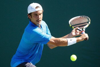 KEY BISCAYNE, FL - MARCH 23:  Ryan Sweeting returns against Xavier Malisse of Belgium during the Sony Ericsson Open at Crandon Park Tennis Center on March 23, 2011 in Key Biscayne, Florida.  (Photo by Matthew Stockman/Getty Images)