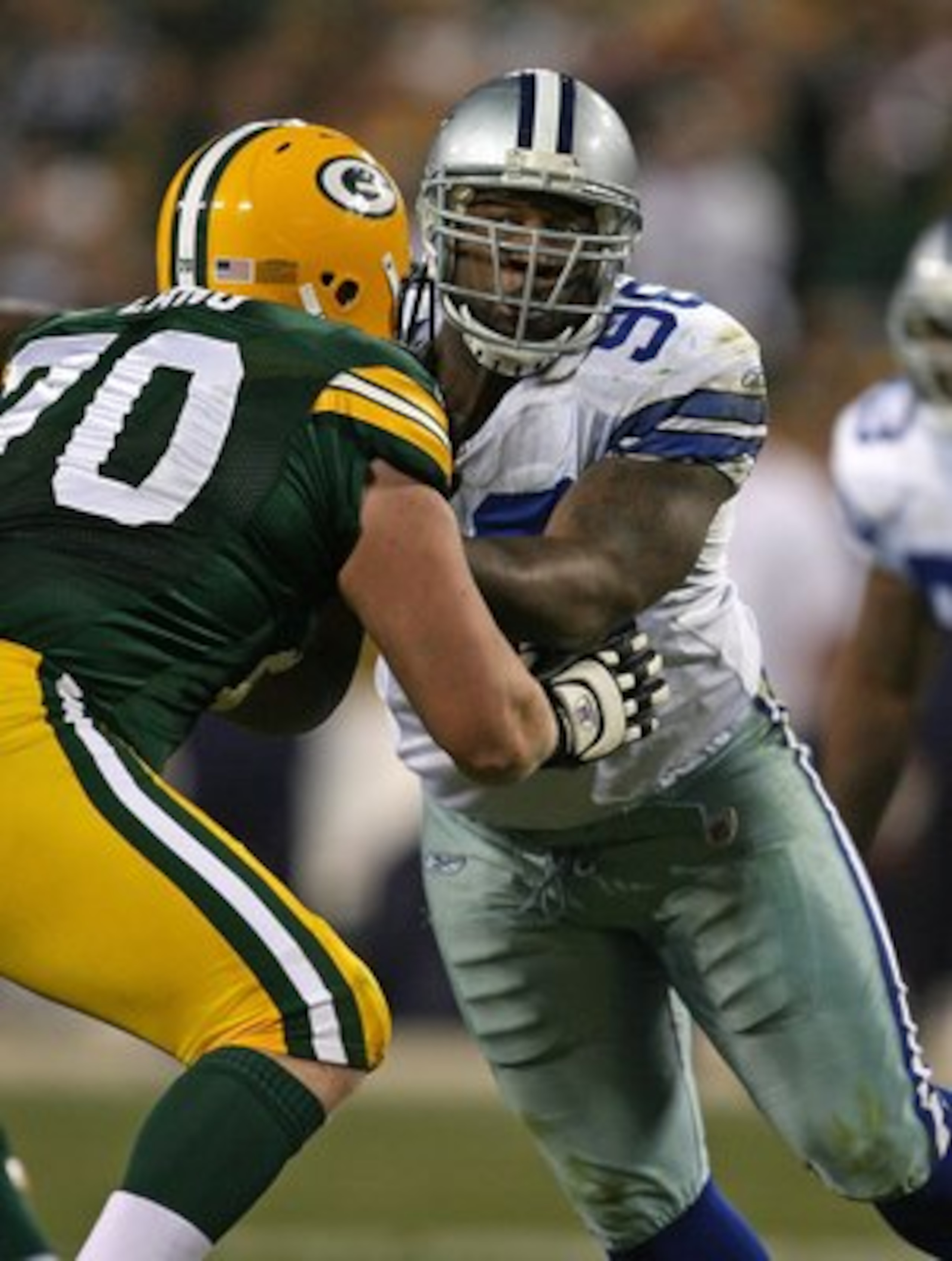 GREEN BAY, WI - NOVEMBER 15: Marcus Spears #96 of the Dallas Cowboys rushes against T.J. Lang #70 of the Green Bay Packers at Lambeau Field on November 15, 2009 in Green Bay, Wisconsin. The Packers defeated the Cowboys 17-7. (Photo by Jonathan Daniel/Gett