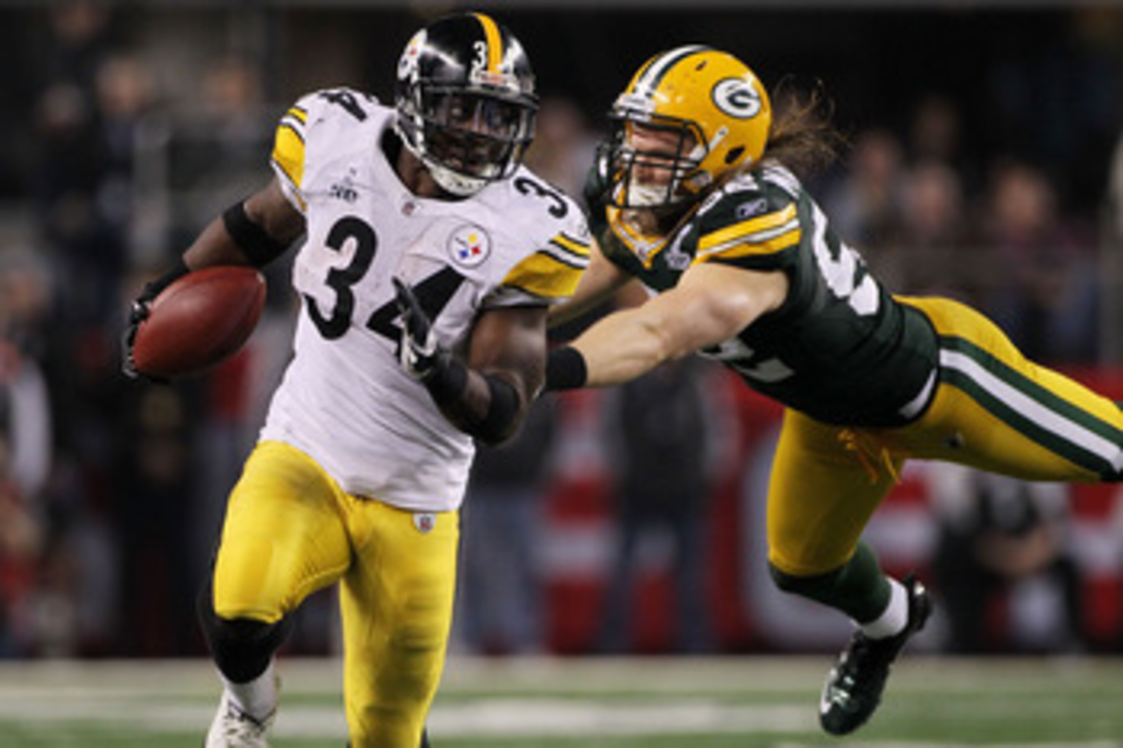 ARLINGTON, TX - FEBRUARY 06:  Rashard Mendenhall #34 of the Pittsburgh Steelers tries to avoid the tackle of Clay Matthews #52 of the Green Bay Packers during the third quarter of Super Bowl XLV at Cowboys Stadium on February 6, 2011 in Arlington, Texas. 