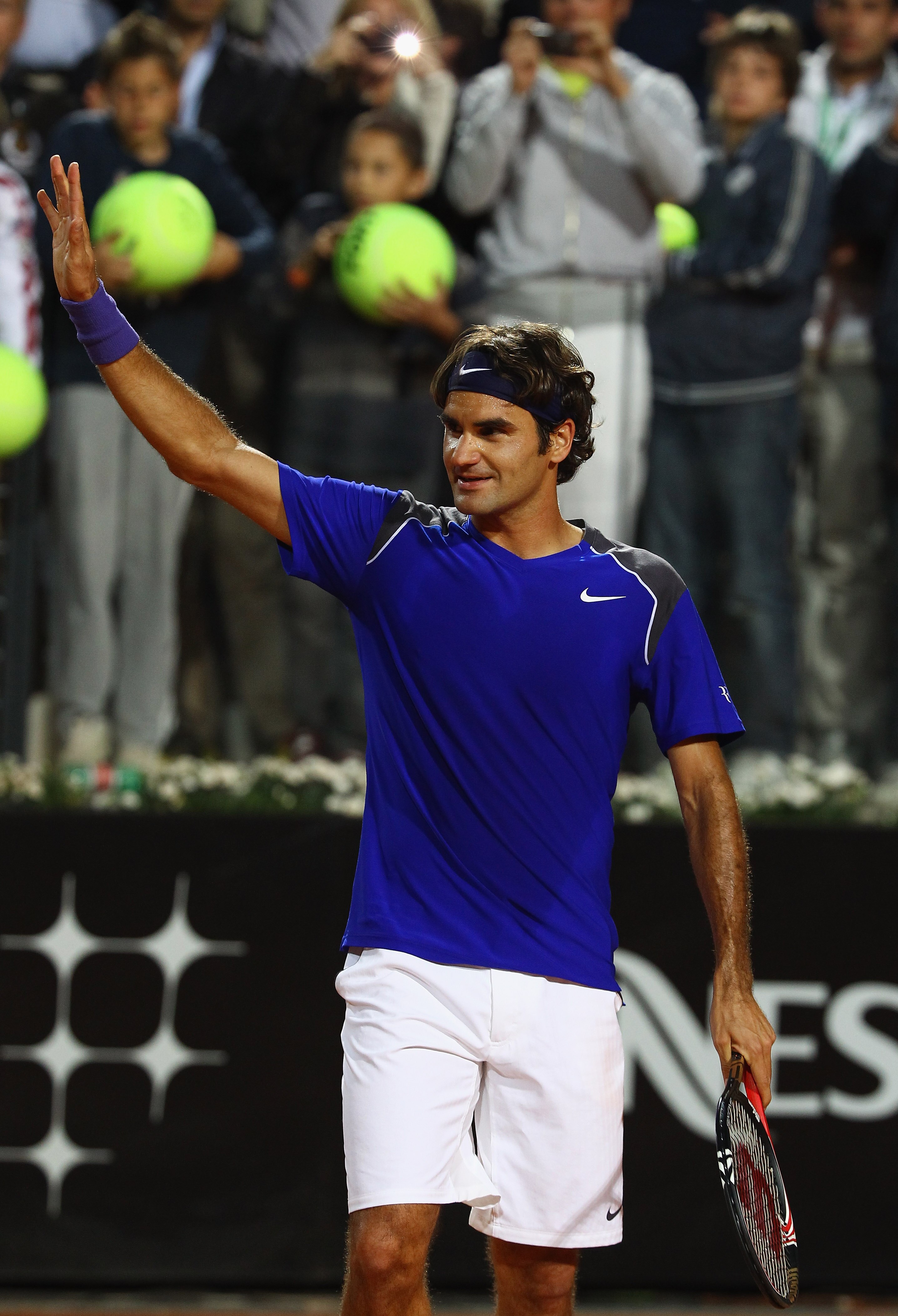 ROME, ITALY - MAY 11:  Roger Federer of Switzerland waves to the crowd after his straight sets victory in his second round match against Jo-Wilfried Tsonga of France during day four of the Internazoinali BNL D'Italia at the Foro Italico Tennis Centre on M