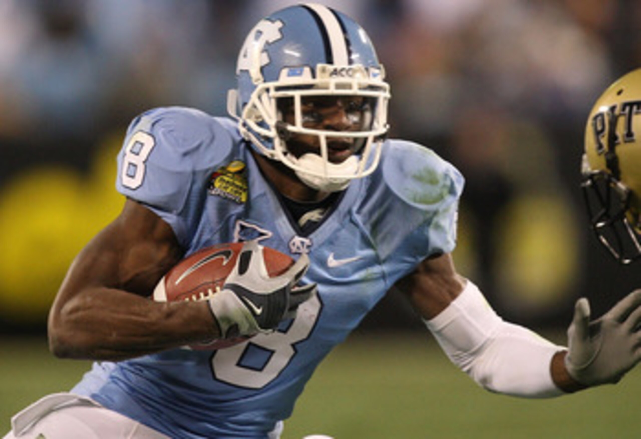 CHARLOTTE, NC - DECEMBER 26:  Aaron Berry #17 of the Pittsburgh Panthers tackles Greg Little #8 of the North Carolina Tar Heels during their game on December 26, 2009 in Charlotte, North Carolina.  (Photo by Streeter Lecka/Getty Images)