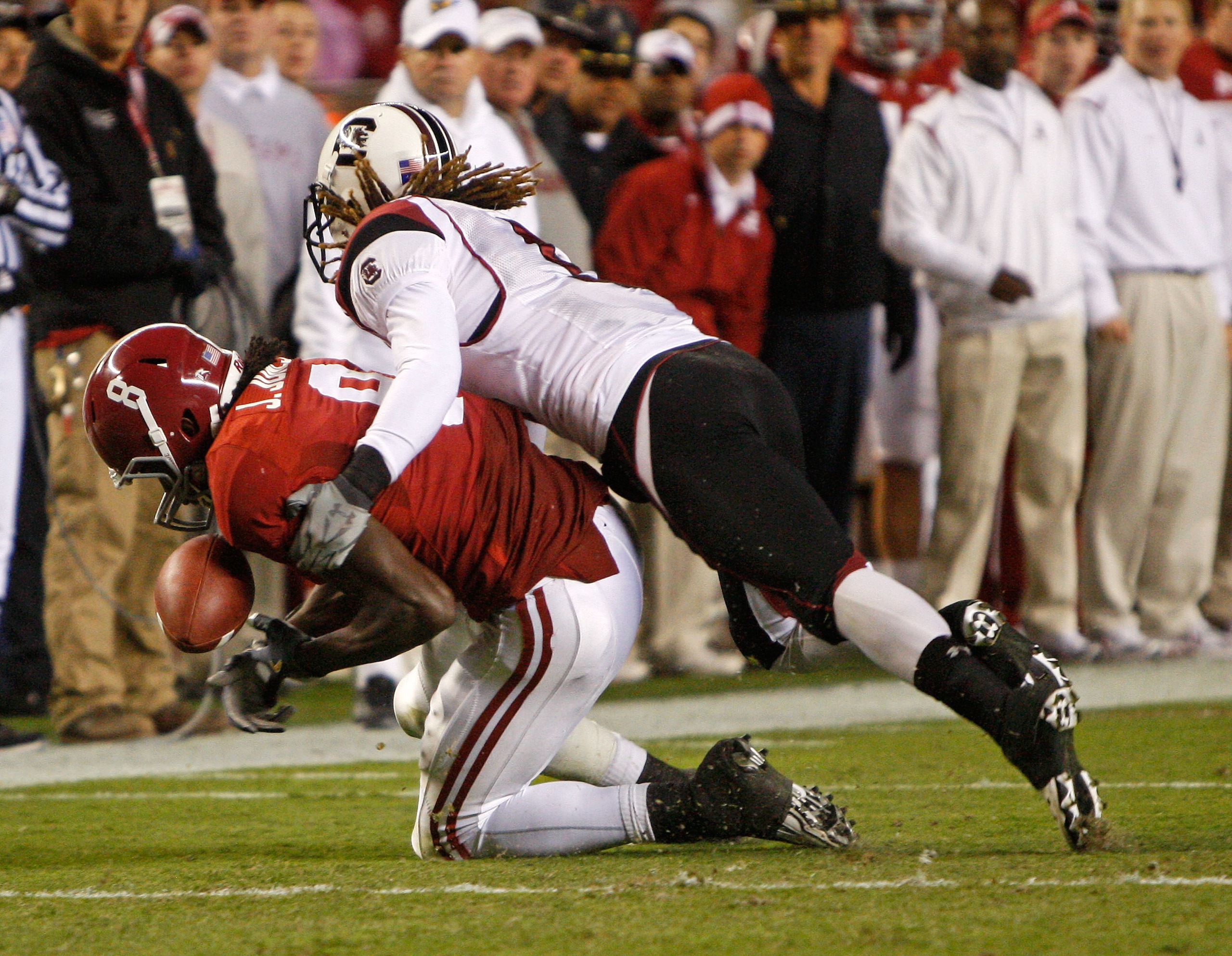 TUSCALOOSA - OCTOBER 17:  Wide receiver Julio Jones #8 of the Alabama Crimson Tide drops a pass while being defended by a South Carolina Gamecocks defender during the game at Bryant-Denny Stadium on October 17, 2009 in Tuscaloosa, Alabama. The Crimson Tid