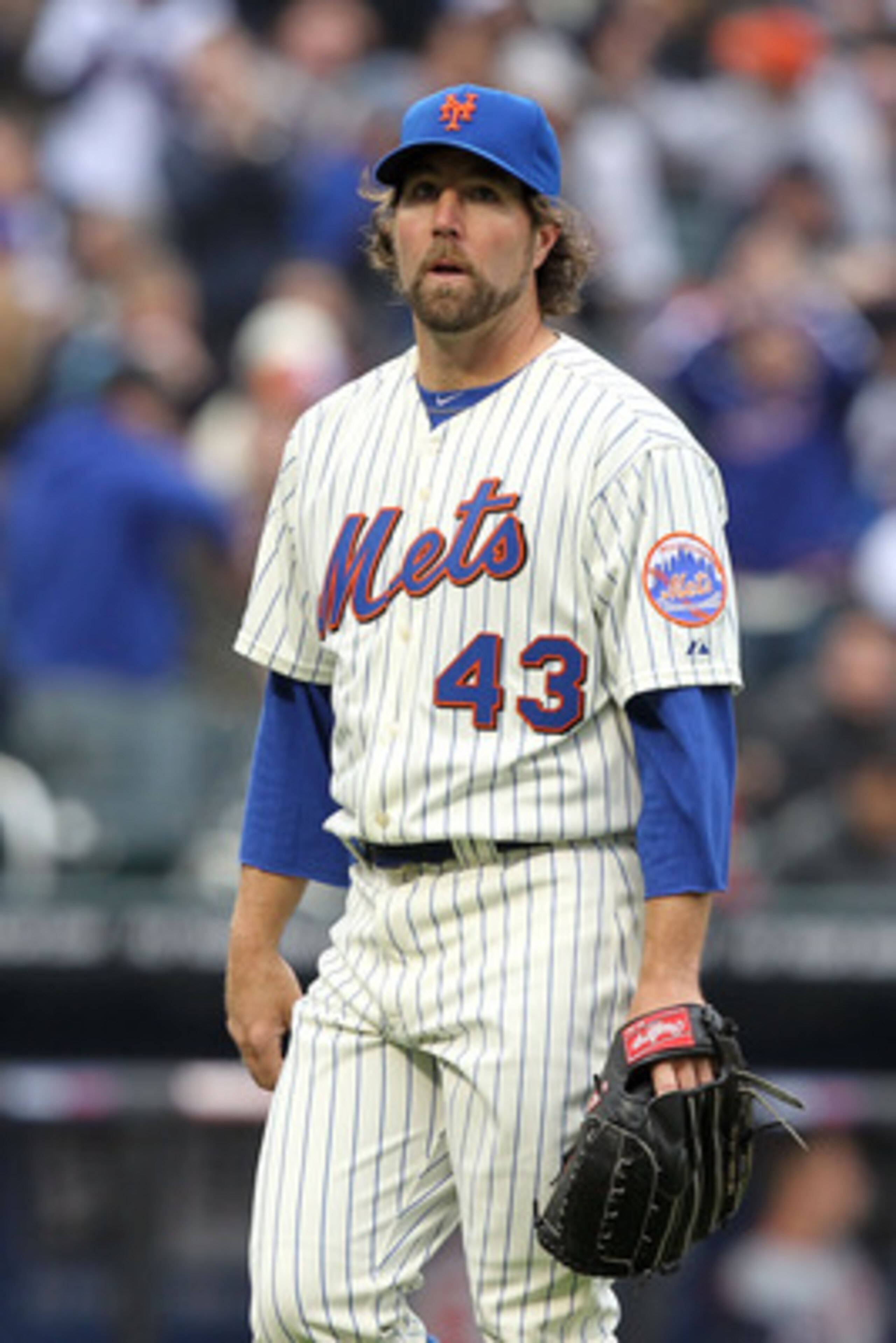 NEW YORK, NY - APRIL 08:  Starting pitcher R.A. Dickey #43 of the New York Mets walks towards the dugout against the Washington Nationals during the Mets' Home Opener at Citi Field on April 8, 2011 in the Flushing neighborhood of Queens in New York City.