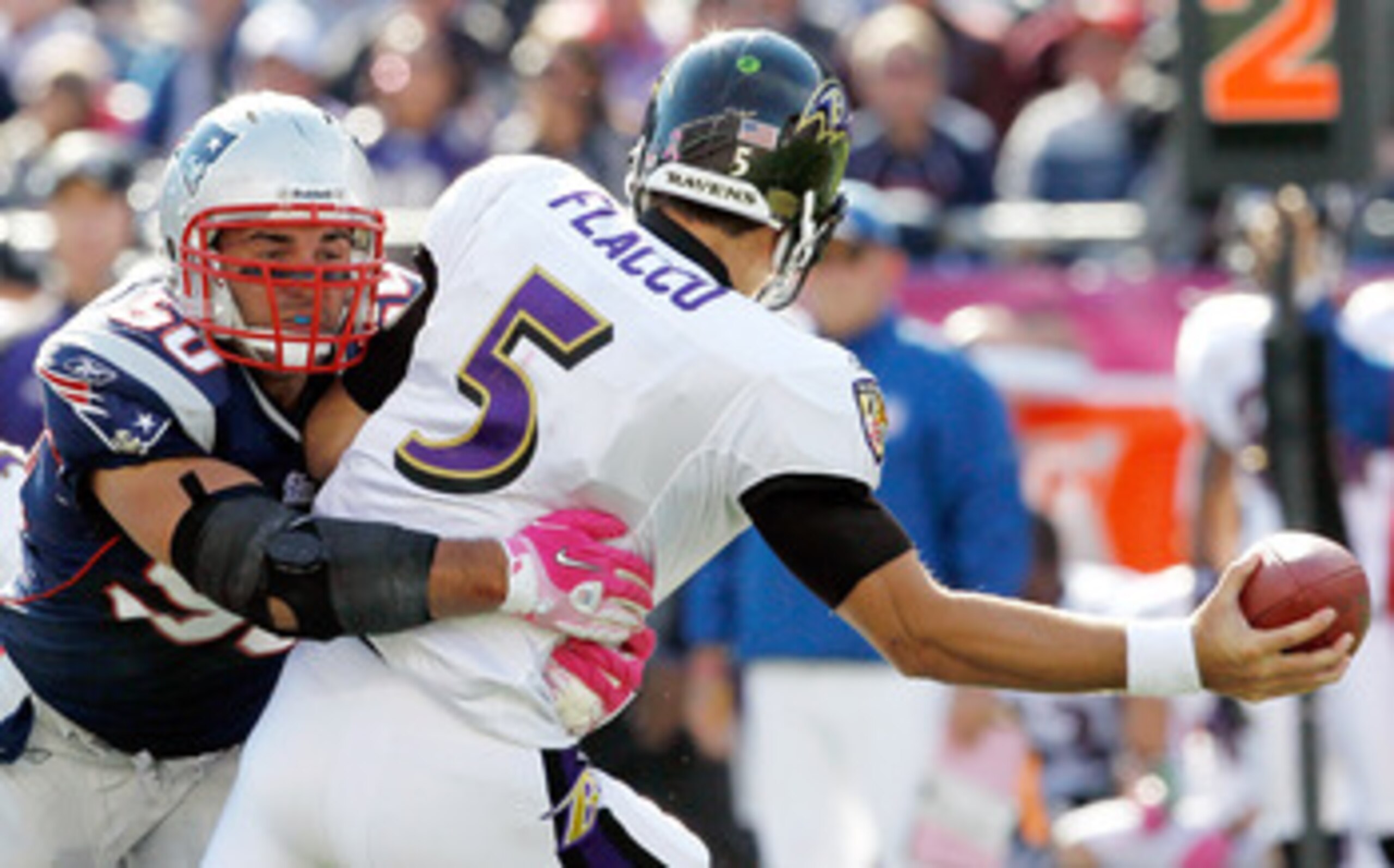 FOXBORO, MA - OCTOBER 17:  Rob Ninkovich #50 of the New England Patriots sacks Joe Flacco #5 of the Baltimore Ravens in the first half at Gillette Stadium on October 17, 2010 in Foxboro, Massachusetts. The Patriot won 23-20 in overtime.  (Photo by Jim Rog