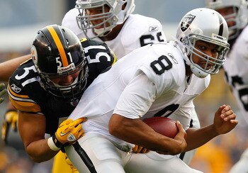 PITTSBURGH - NOVEMBER 21:  Jason Campbell #8 of the Oakland Raiders is sacked by James Farrior #51 of the Pittsburgh Steelers during the game on November 21, 2010 at Heinz Field in Pittsburgh, Pennsylvania.  (Photo by Jared Wickerham/Getty Images)