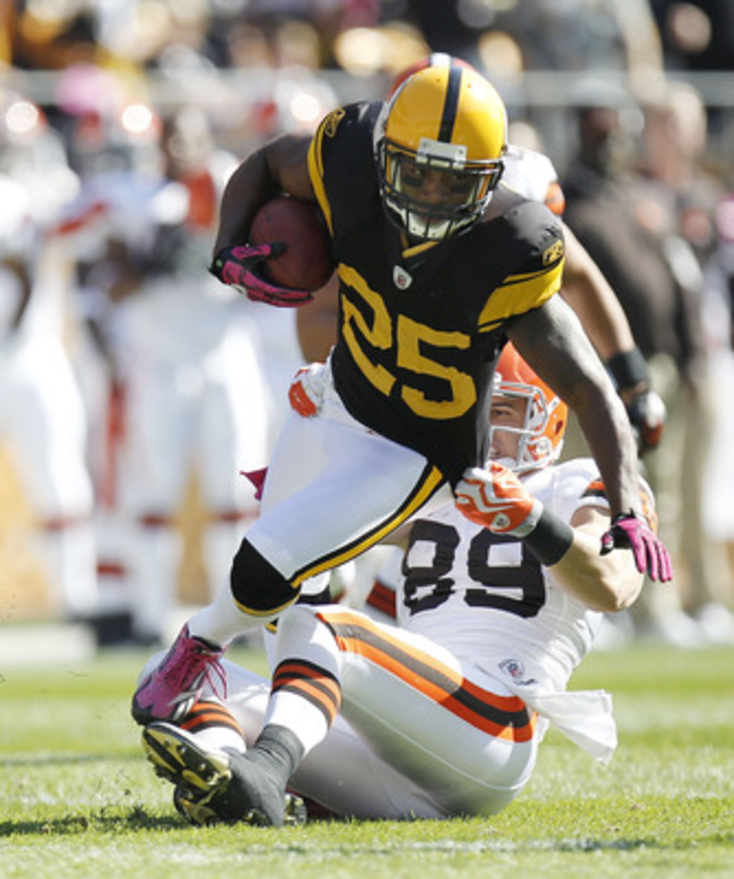 PITTSBURGH - OCTOBER 17:  Ryan Clark #25 of the Pittsburgh Steelers tries to escape the tackle of Evan Moore #89 of the Cleveland Browns after a first quarter interception on October 17, 2010 at Heinz Field in Pittsburgh, Pennsylvania.  (Photo by Gregory 